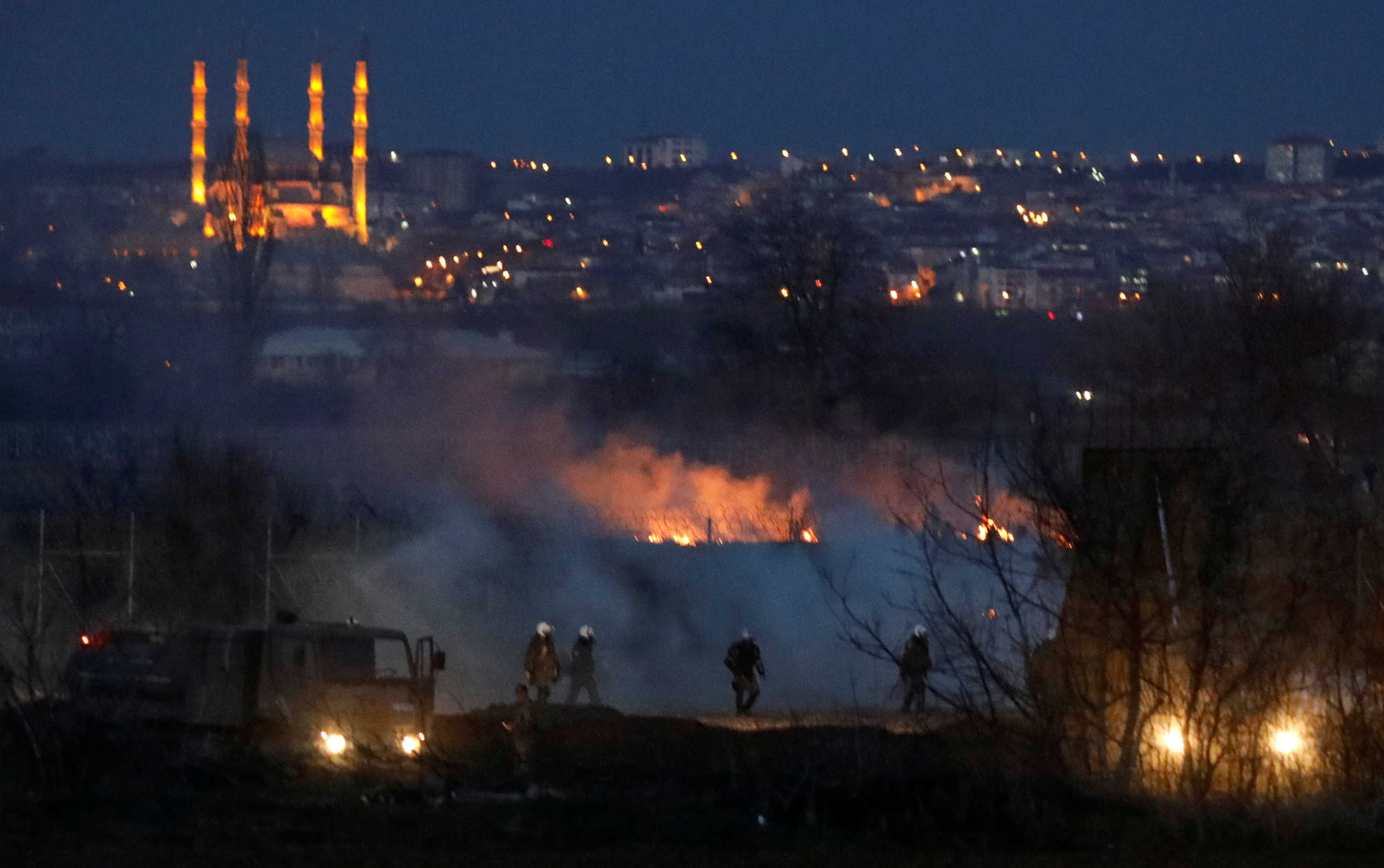 Smoke and fire are seen near Turkey's Pazarkule border crossing, in Kastanies, Greece March 7, 2020. REUTERS