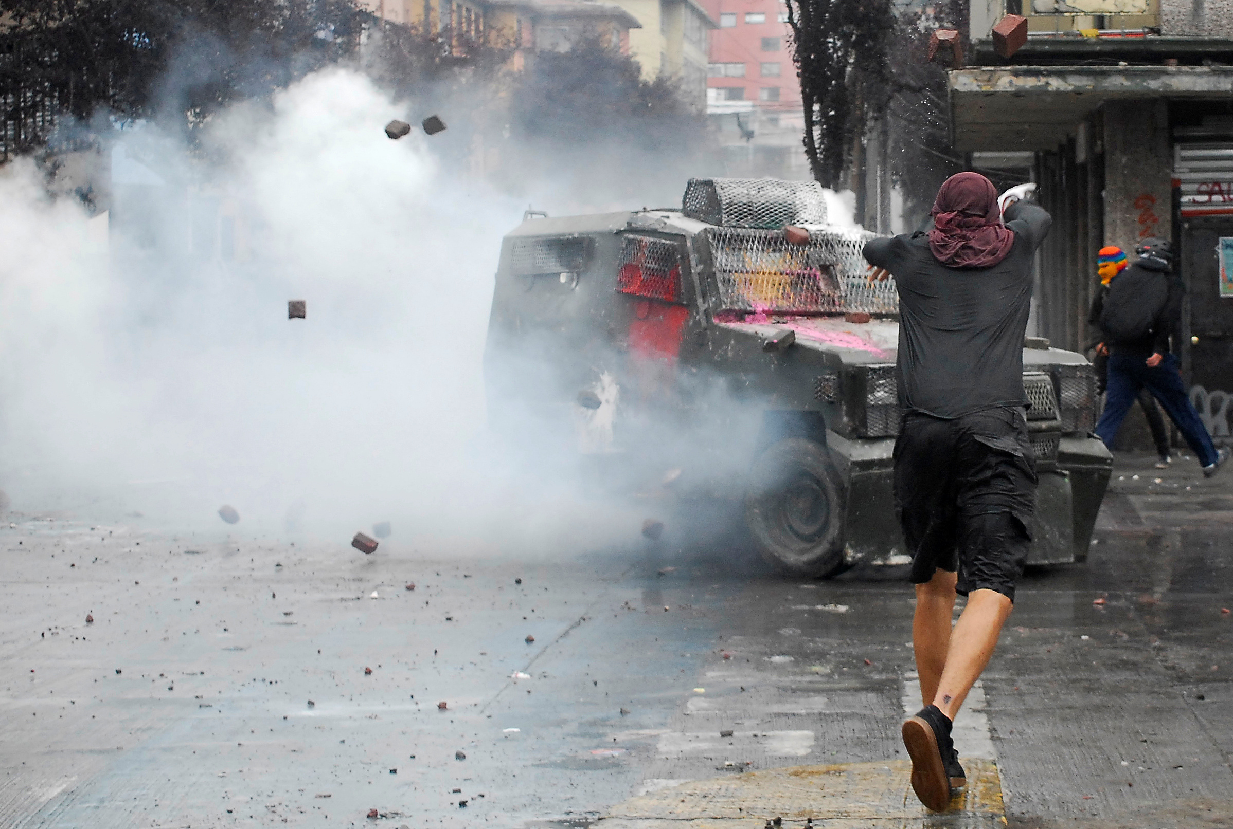 Demonstrators clash with security forces during a protest day in the Chilean calendar known as "Super Lunes", to protest against Chile's government and high living costs, in Concepcion, Chile  March 2, 2020. REUTERS