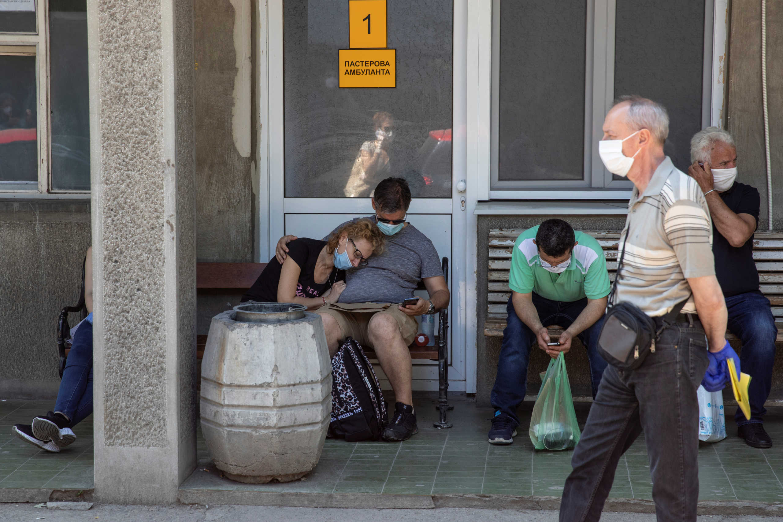 People suspected to have coronavirus disease (COVID-19) stand in front of the Hospital for Infectious and Tropical Diseases of the Clinical Center of Serbia in Belgrade, Serbia June 26, 2020. REUTERS