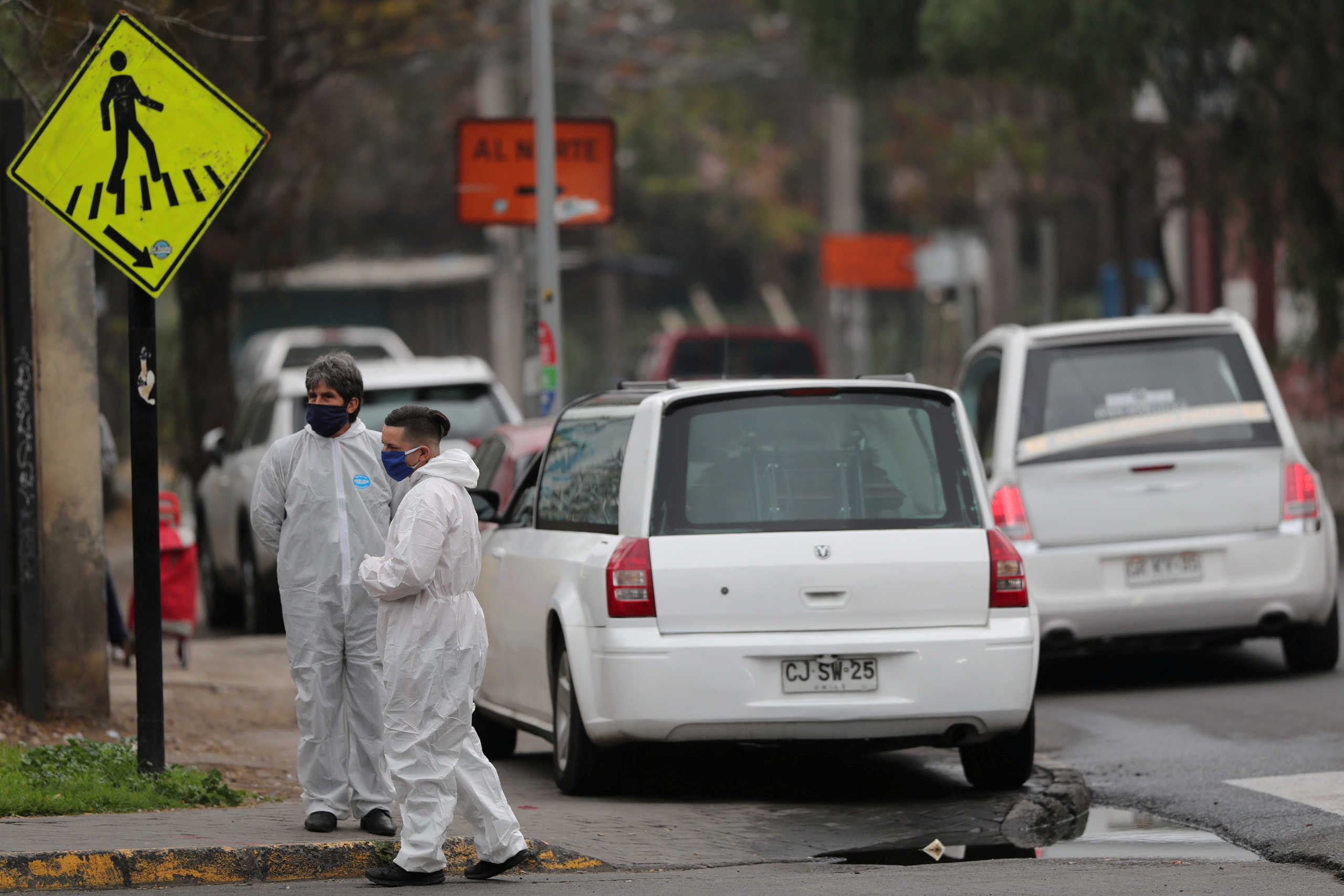 FILE PHOTO: Mortuary workers wait outside the San Jose public hospital morgue, amid the spread of the coronavirus disease (COVID-19) in Santiago, Chile May 28, 2020. REUTERS