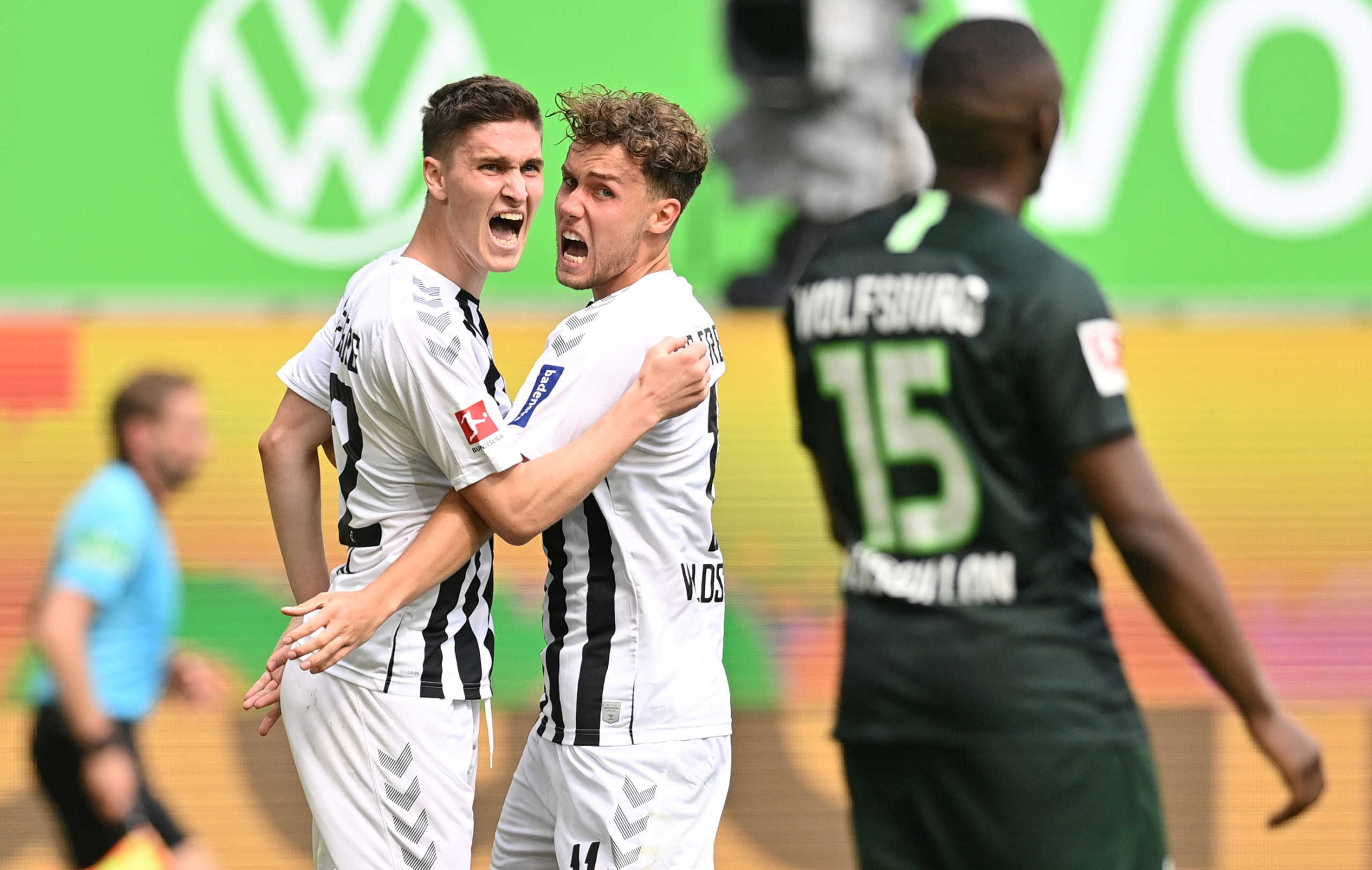 Soccer Football - Bundesliga - VfL Wolfsburg v SC Freiburg - Volkswagen Arena, Wolfsburg, Germany - June 13, 2020 SC Freiburg's Roland Sallai celebrates scoring their second goal with Luca Waldschmidt, as play resumes behind closed doors following the outbreak of the coronavirus disease (COVID-19) Sascha Steinbach