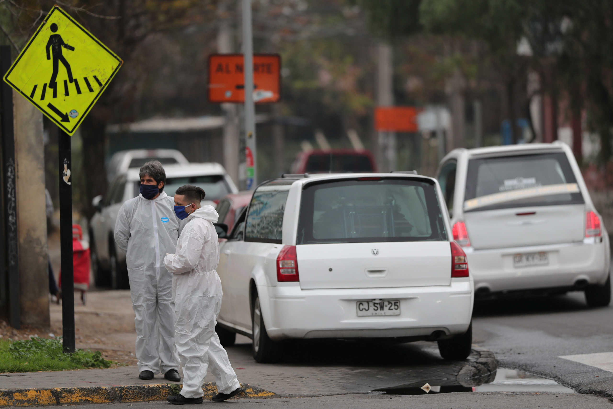 Mortuary workers wait outside the San Jose public hospital morgue, amid the spread of the coronavirus disease (COVID-19) in Santiago, Chile May 28, 2020. REUTERS