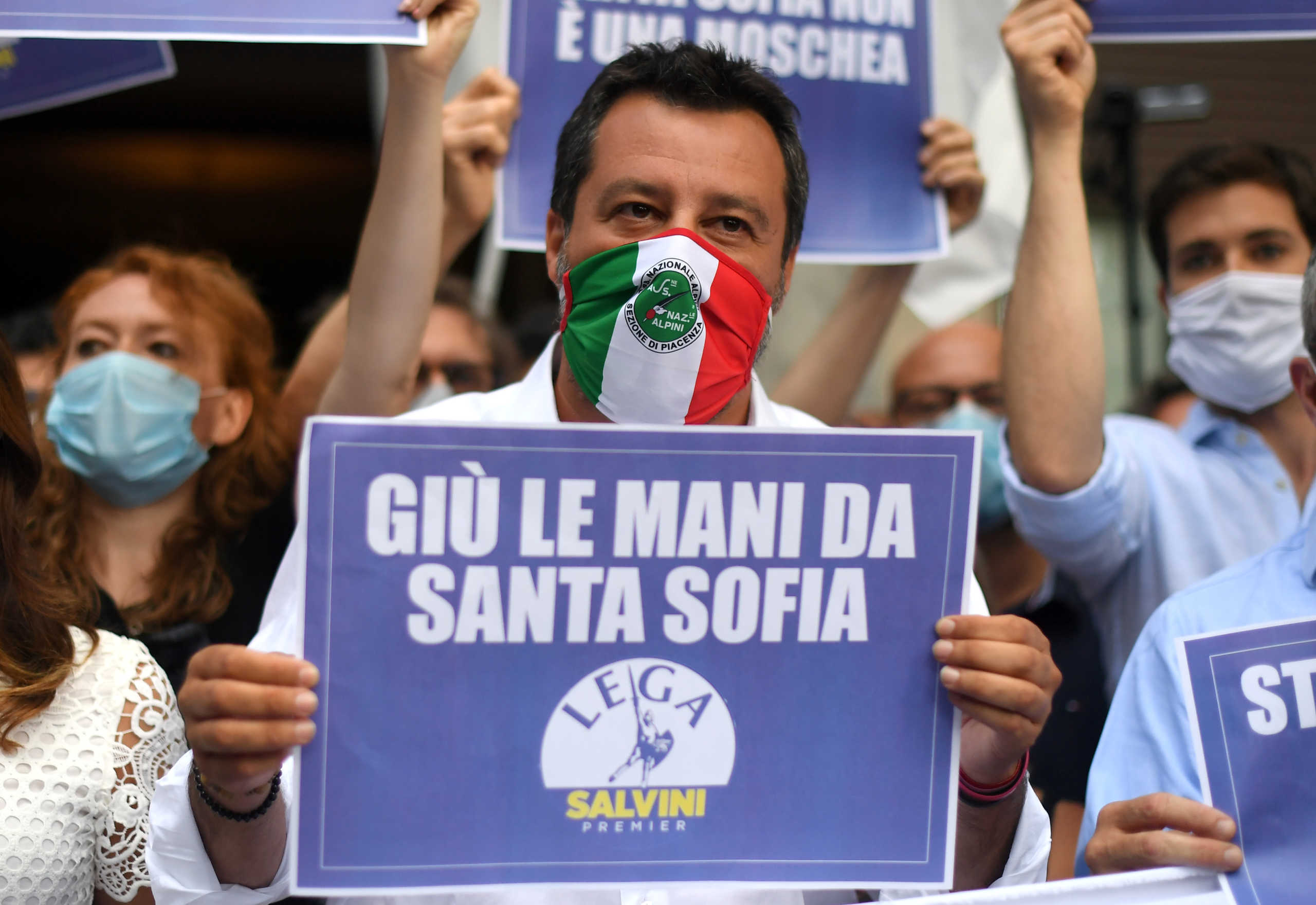 Leader of Italy's far-right League party Matteo Salvini holds a banner reading "Take your hands off Hagia Sophia" as he leads a demonstration outside the Turkish Consulate, against Turkey's decision to make Istanbul's Hagia Sophia museum a mosque, in Milan, Italy, July 13, 2020. REUTERS