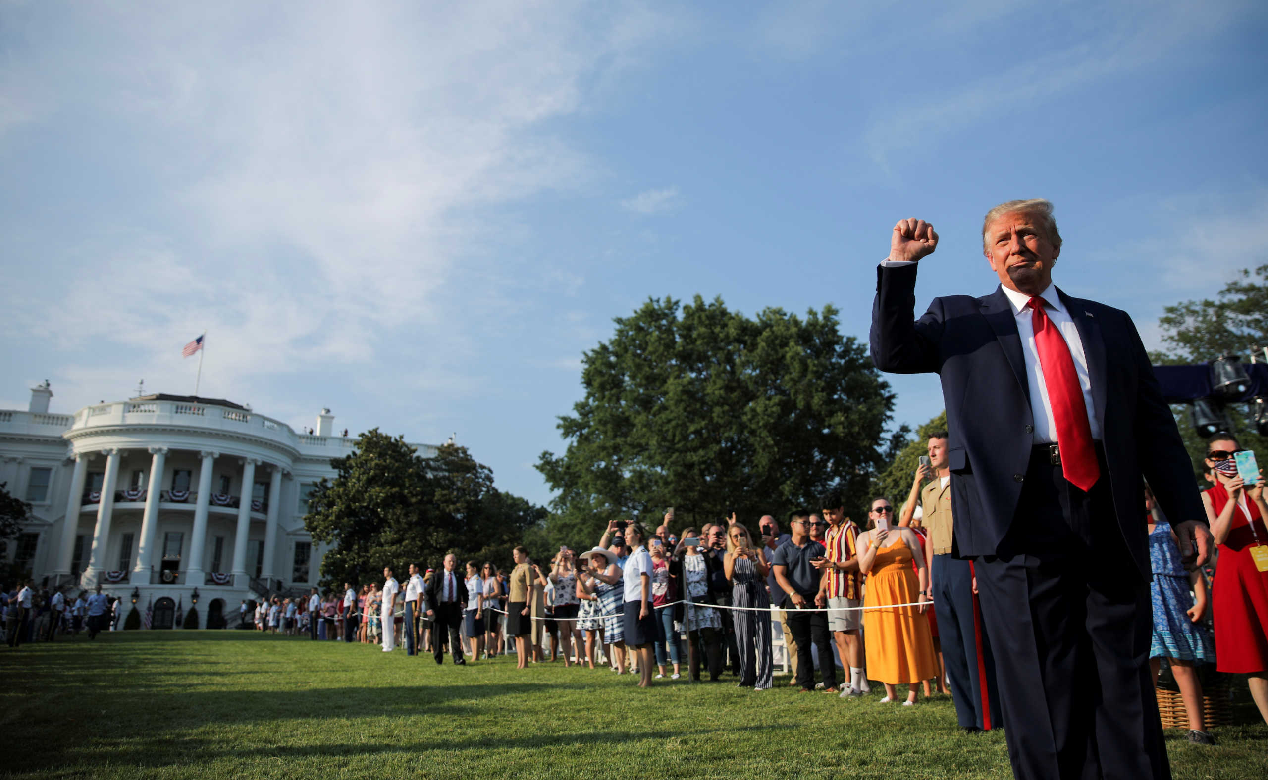 U.S. President Donald Trump thrusts his fist as he arrives on the White House South Lawn to host a 4th of July "2020 Salute to America" to celebrate the U.S. Independence Day holiday at the White House in Washington, U.S., July 4, 2020.   REUTERS