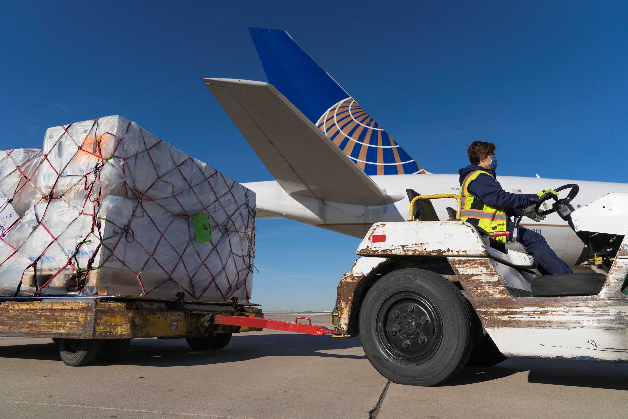 FILE PHOTO: A shipment of Pfizer's coronavirus disease (COVID-19) vaccines is unloaded from a United Airlines cargo-only flight from Brussels to O'Hare International Airport in Chicago, Illinois, U.S. December 2, 2020. Picture taken December 2, 2020.  United Airlines