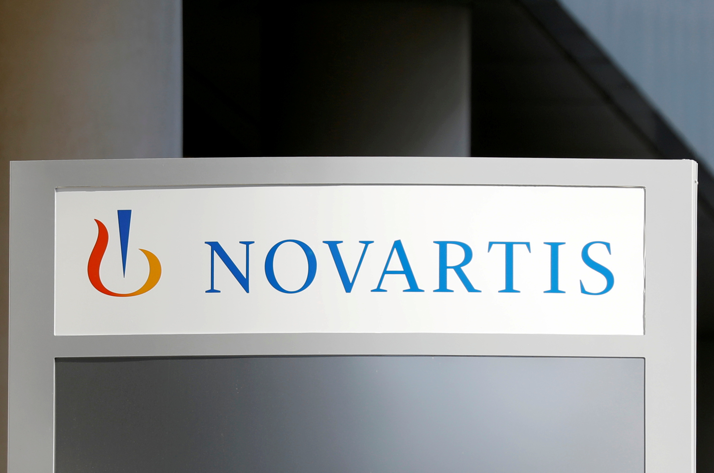 FILE PHOTO: The logo of Swiss drugmaker Novartis is pictured at the French company's headquarters in Rueil-Malmaison near Paris, France, April 22, 2020. REUTERS