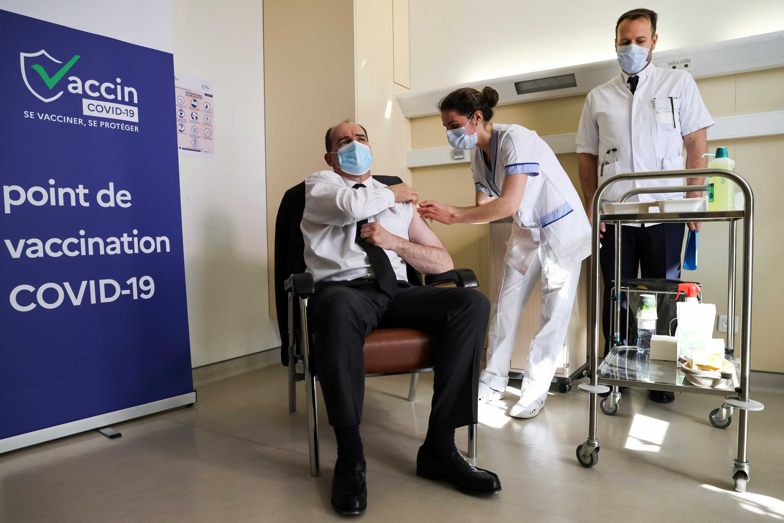 French Prime Minister Jean Castex, 55-years-old, reacts as he is vaccinated with the AstraZeneca COVID-19 vaccine at the Hopital d'Instruction des Armees Begin, in Saint-Mande, on the outskirts of Paris, France March 19, 2021. Thomas Coex