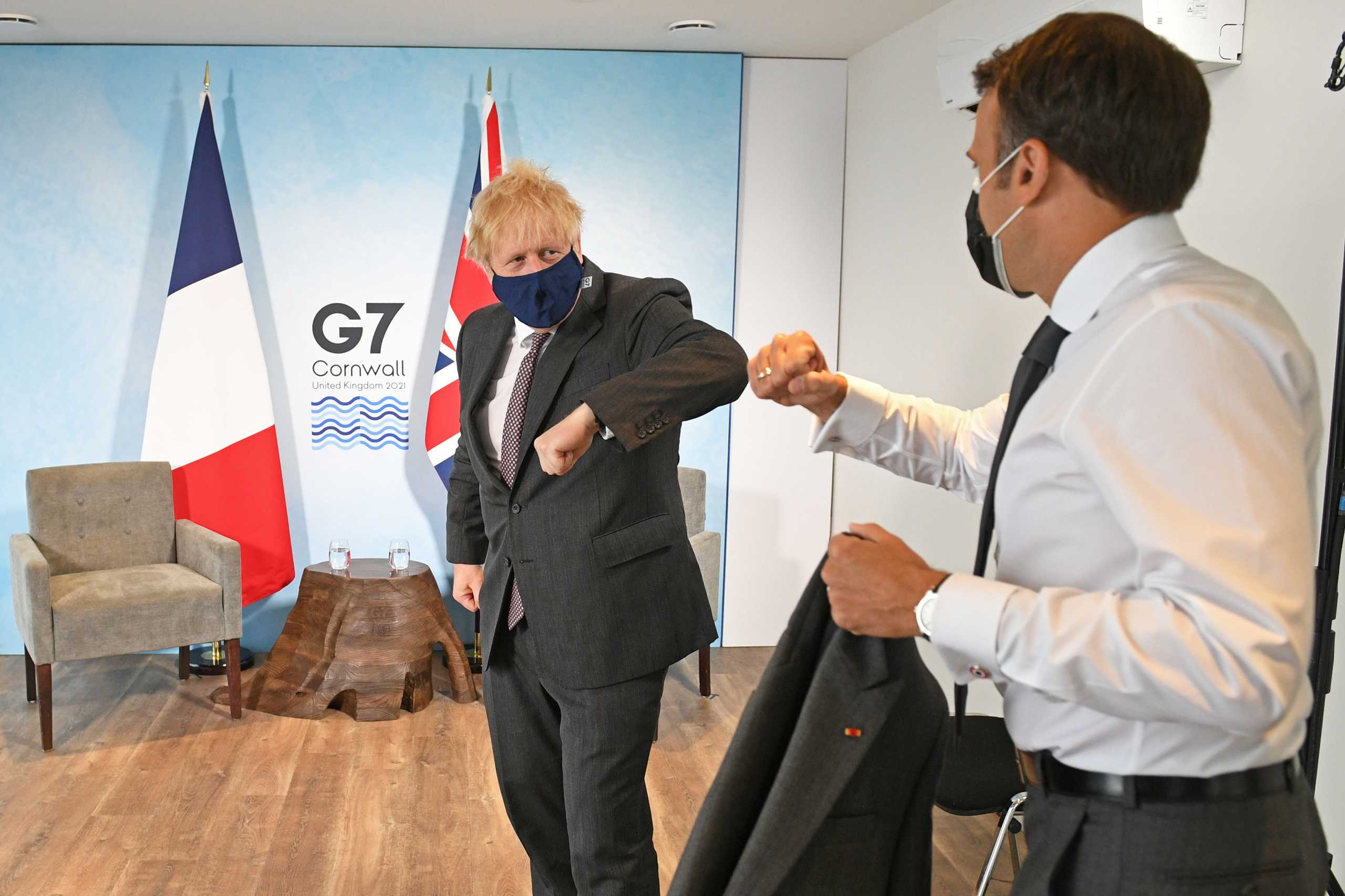 Britain's Prime Minister Boris Johnson and France's President Emmanuel Macron elbow bump as they attend a bilateral meeting during G7 summit in Carbis Bay, Cornwall, Britain, June 12, 2021. Stefan Rousseau