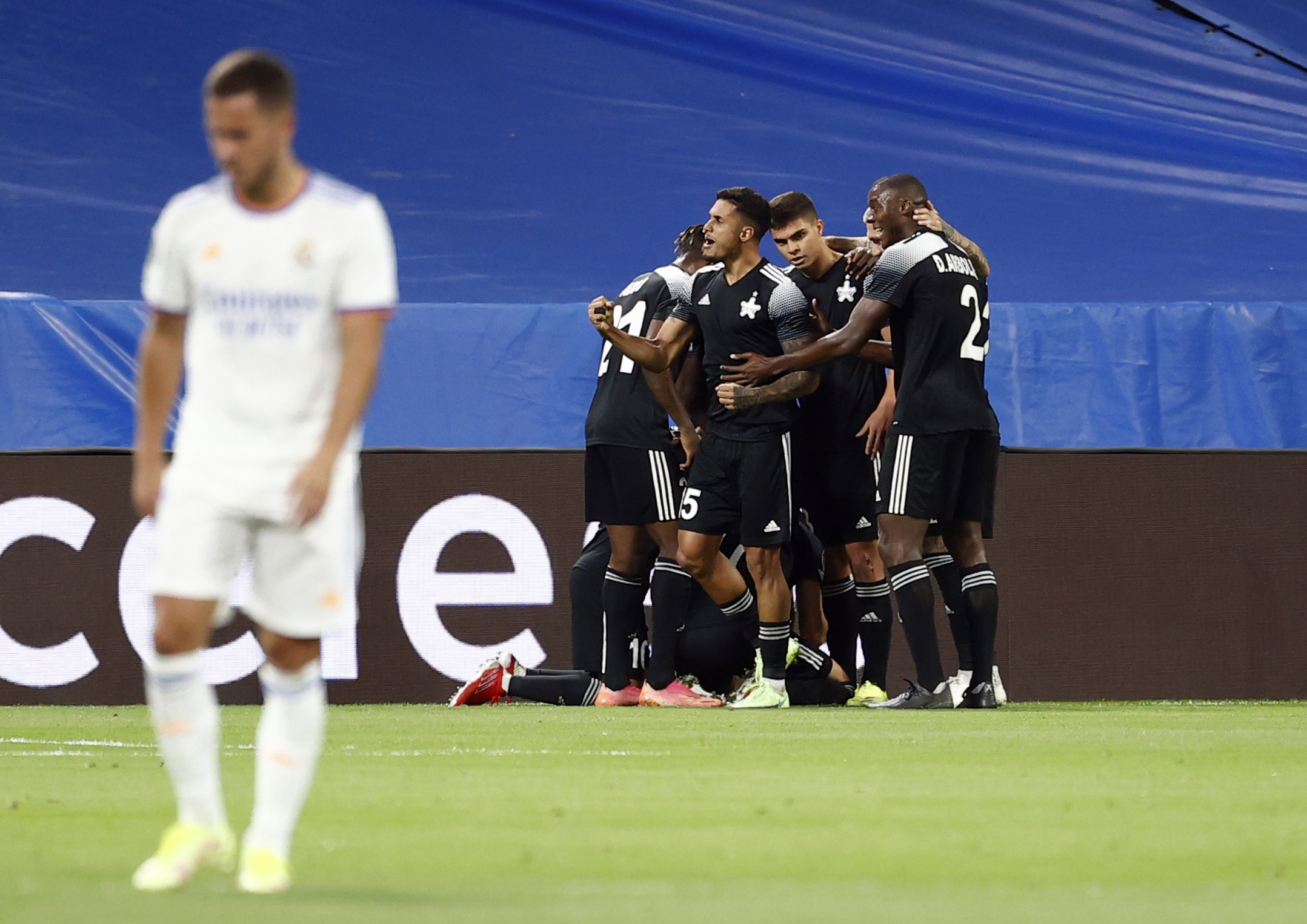 Soccer Football - Champions League - Group D - Real Madrid v Sheriff Tiraspol - Santiago Bernabeu, Madrid, Spain - September 28, 2021 Sheriff Tiraspol's Jasur Jakhshibaev celebrates scoring their first goal with teammates REUTERS