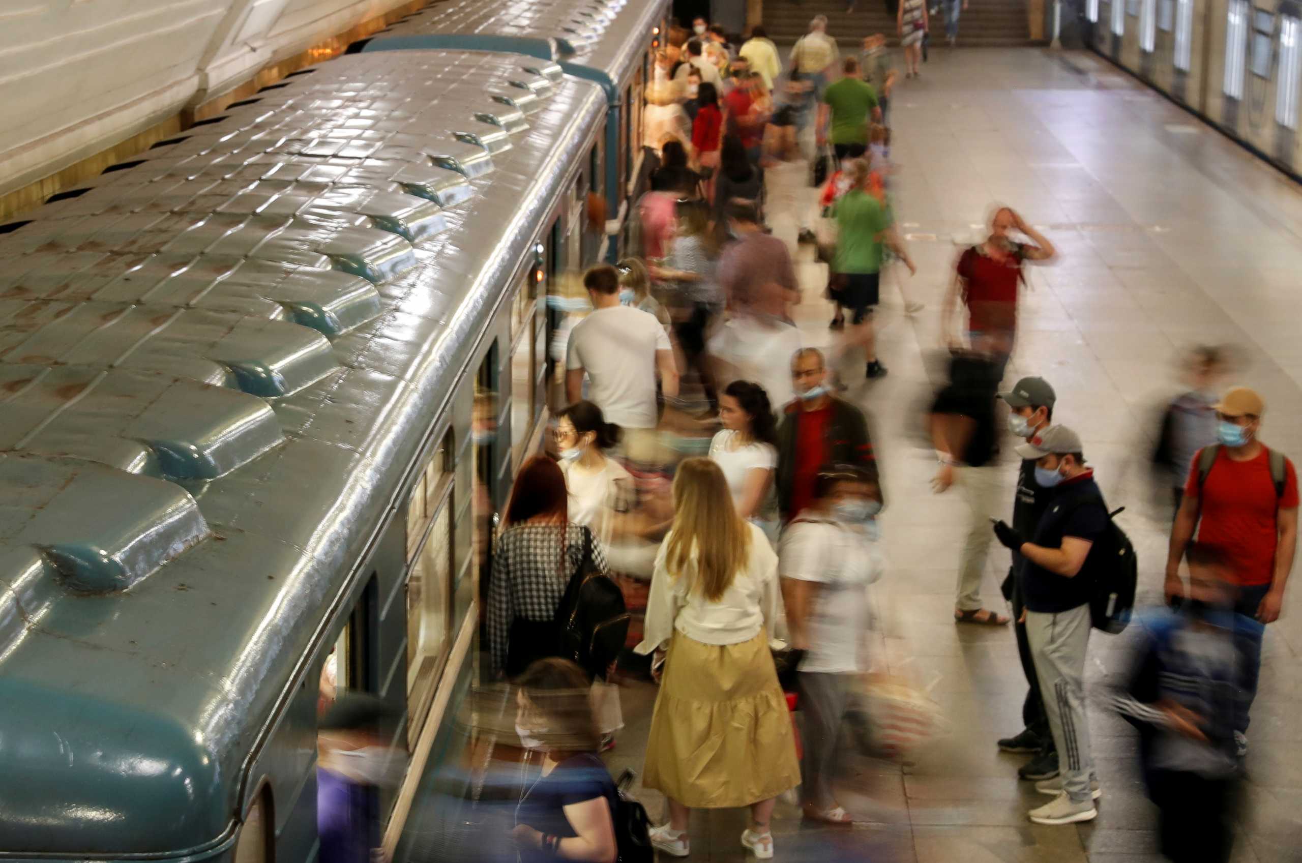 FILE PHOTO: Passengers are seen at a metro station on the first day after a lockdown designed to curb the spread of the coronavirus disease (COVID-19) was lifted in Moscow, Russia June 9, 2020. REUTERS