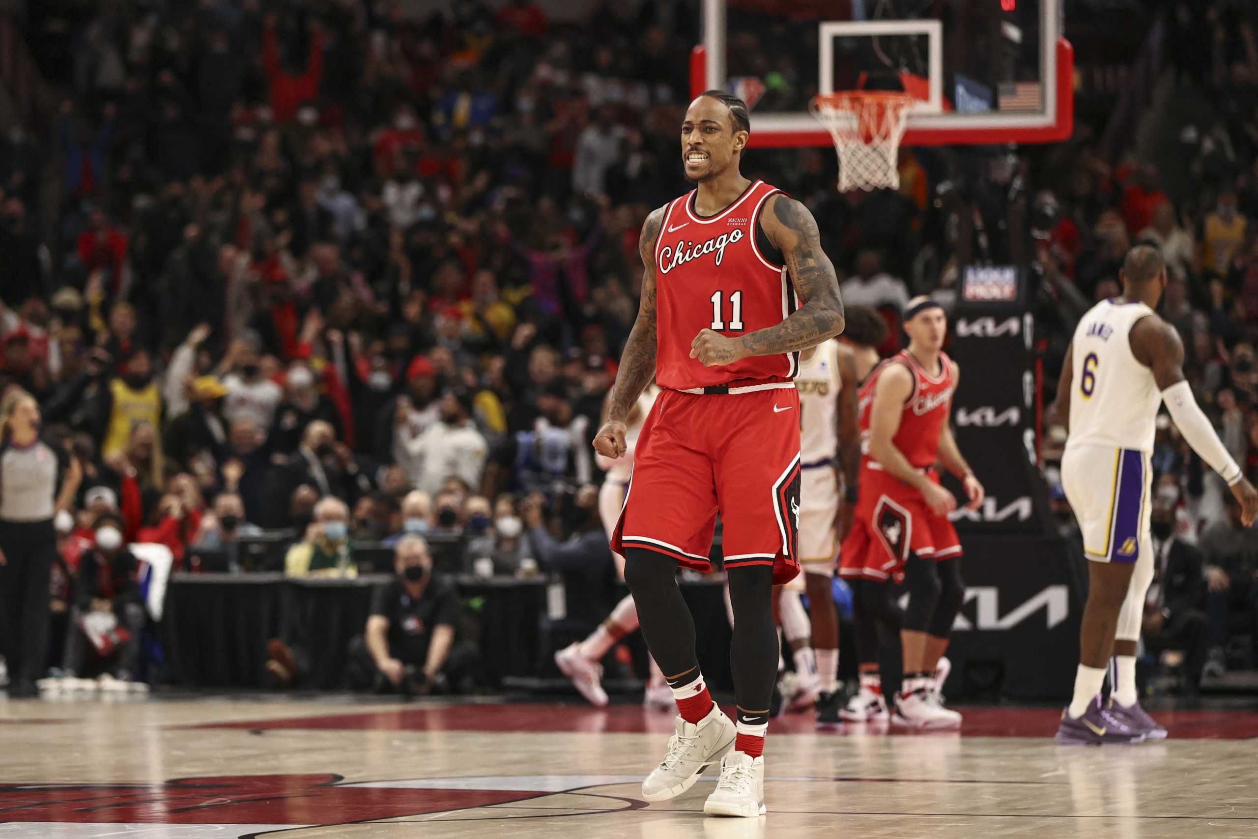 Dec 19, 2021; Chicago, Illinois, USA; Chicago Bulls forward DeMar DeRozan (11) reacts after scoring against the Los Angeles Lakers during the second half at United Center. Mandatory Credit: Kamil Krzaczynski-USA TODAY Sports