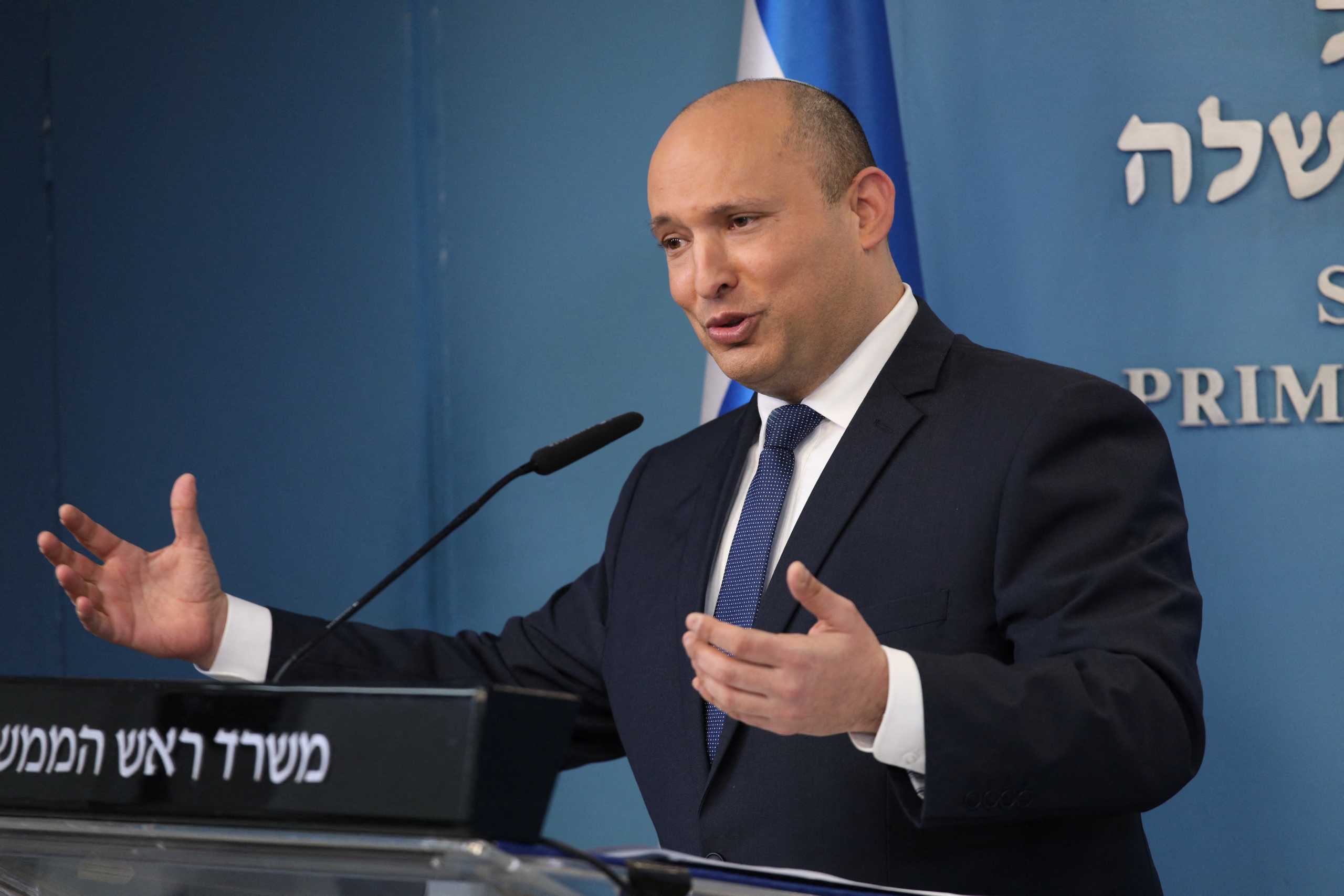 Israeli Prime Minister Naftali Bennett gestures as he speaks during a press conference at the Prime Minister's Office in Jerusalem, January 2, 2022. Emil Salman