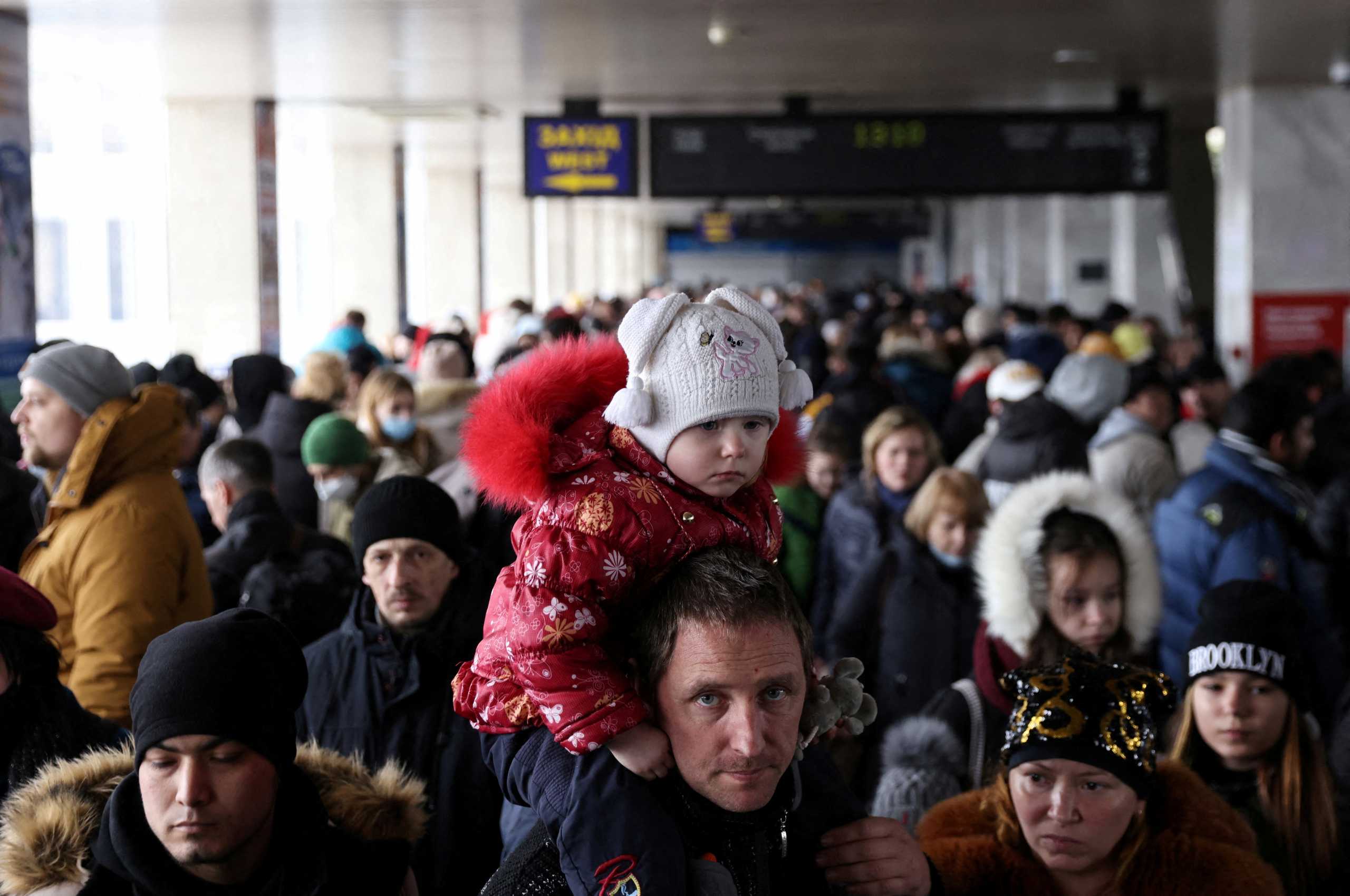 People wait to board an evacuation train from Kyiv to Lviv at Kyiv central train station following Russia's invasion of Ukraine, in Kyiv, Ukraine March 1, 2022. REUTERS