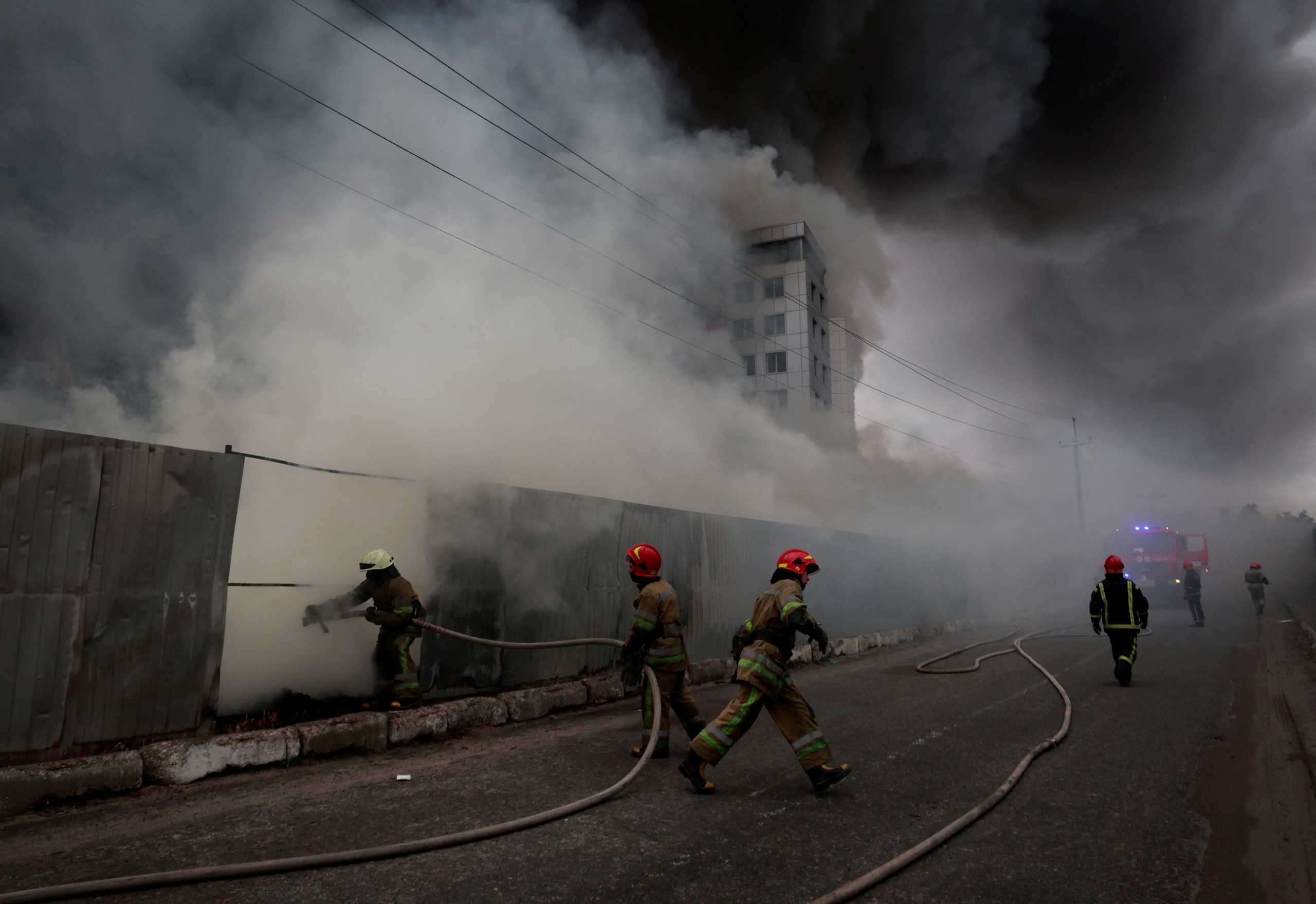 Firefighters extinguish fire at a warehouse that caught flames, according to local authorities, after shelling, as Russia's invasion of Ukraine continues, in the village of Chaiky in the Kyiv region, Ukraine March 3, 2022. REUTERS