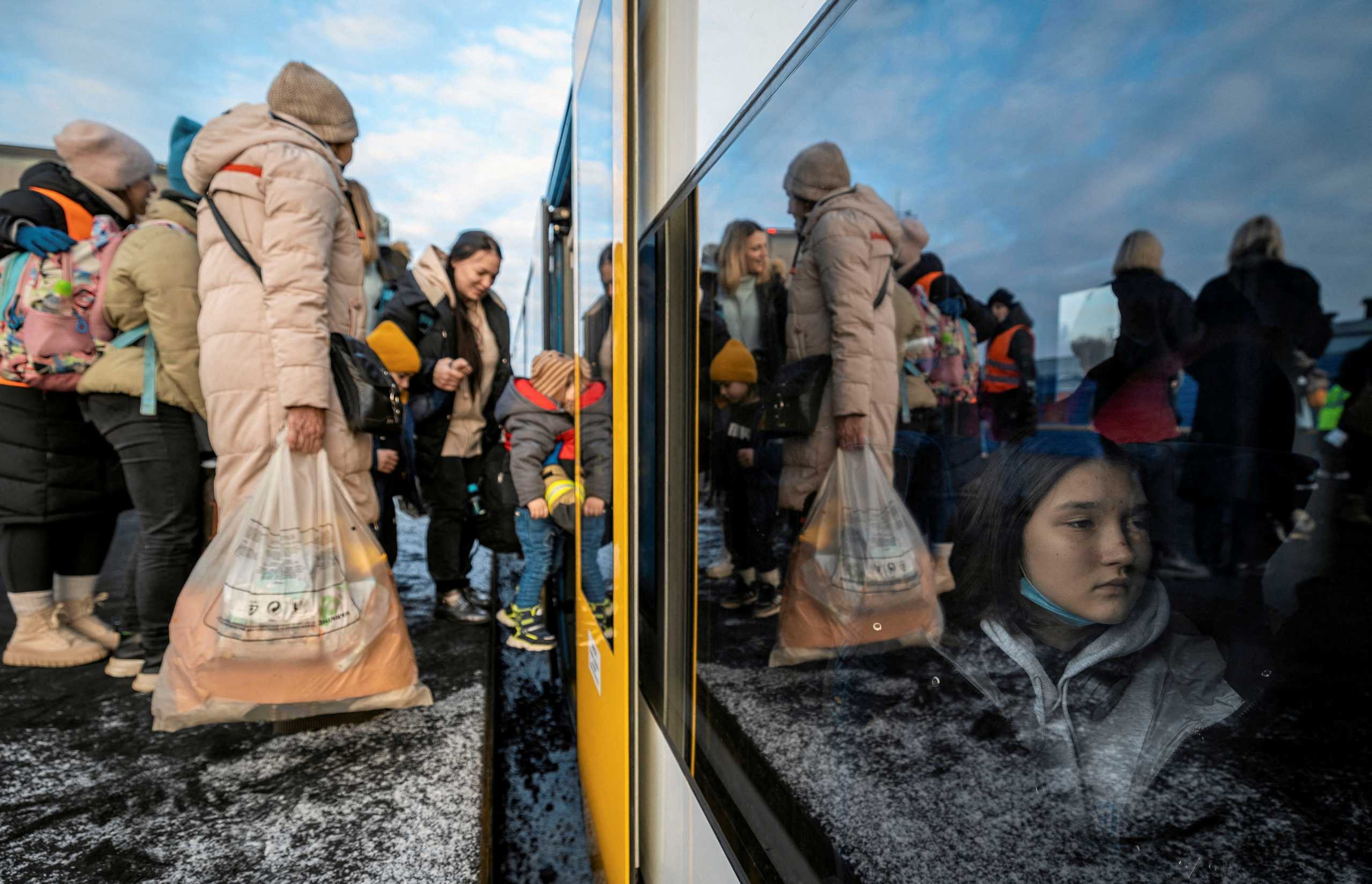 People fleeing Russian invasion of Ukraine change trains at Euroterminal to be transferred to temporary accommodation centers around the country, in Slawkow, Poland March 5, 2022. Grzegorz Celejewski