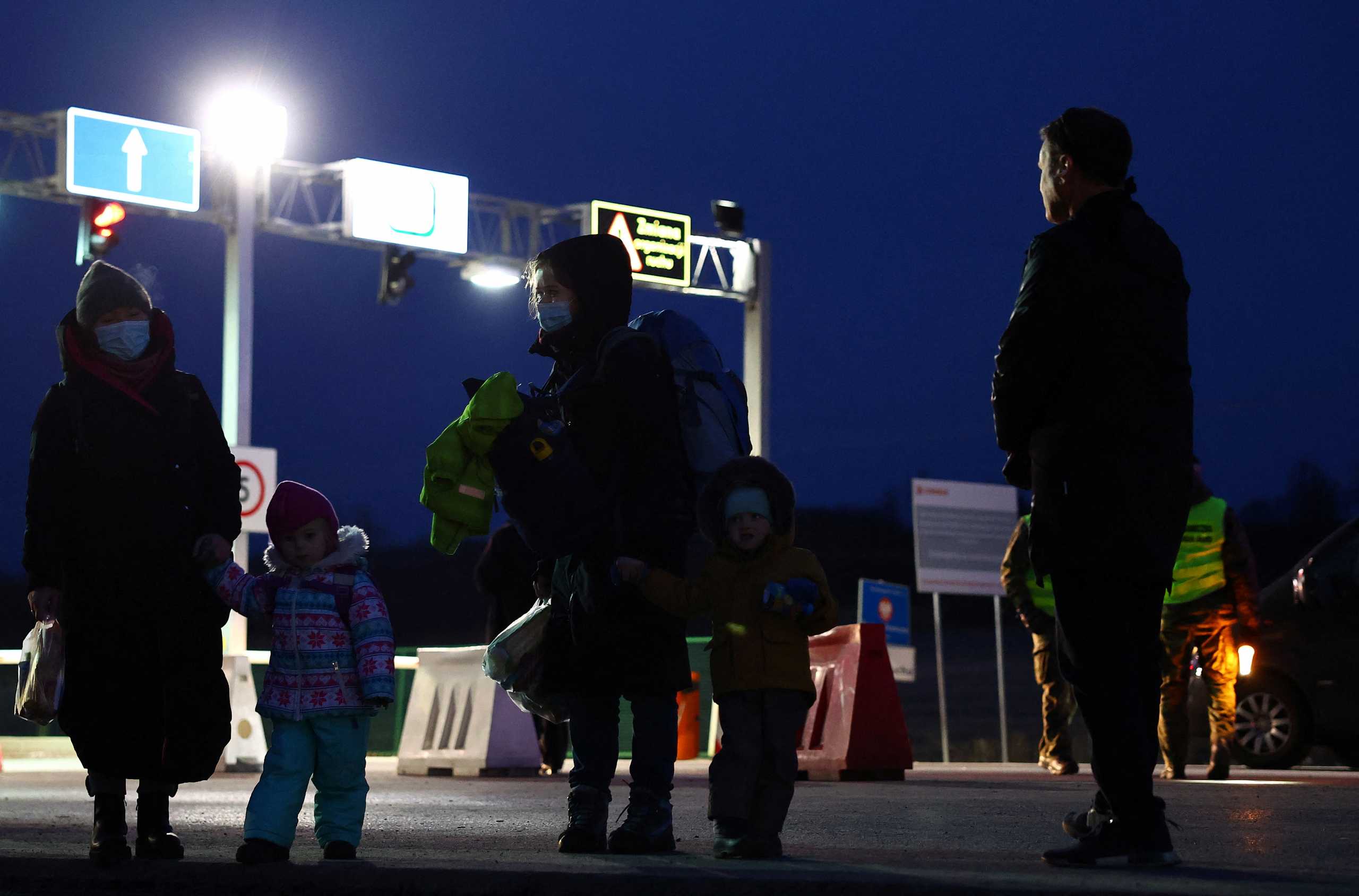 Refugees fleeing from Ukraine due to the Russian invasion passing the border checkpoint in Medyka, Poland, March 1, 2022.   REUTERS