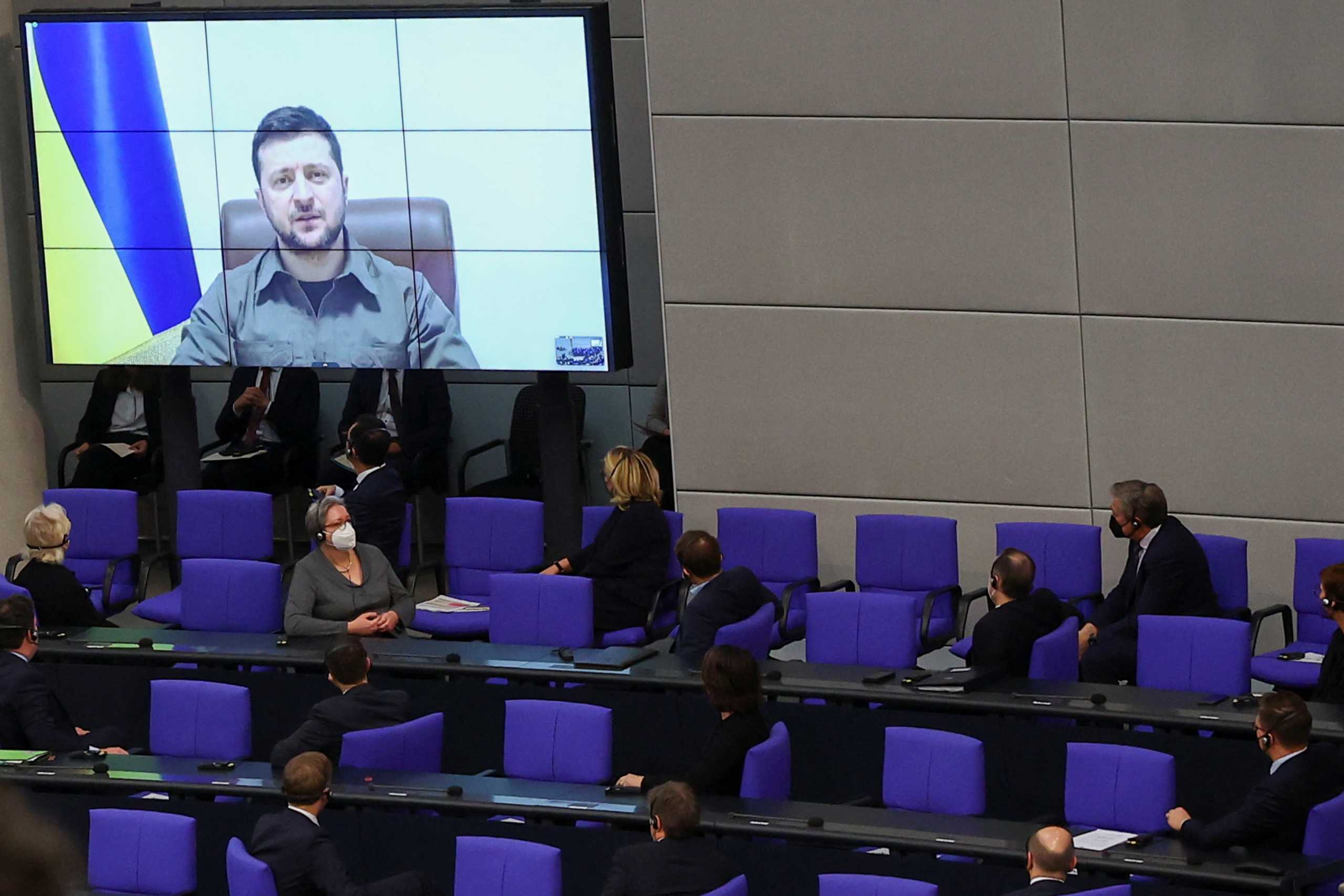 Ukraine's President Volodymyr Zelenskiy addresses Germany's lower house of parliament, the Bundestag, via videolink, after Russia's invasion of Ukraine, in Berlin, Germany, March 17, 2022. REUTERS