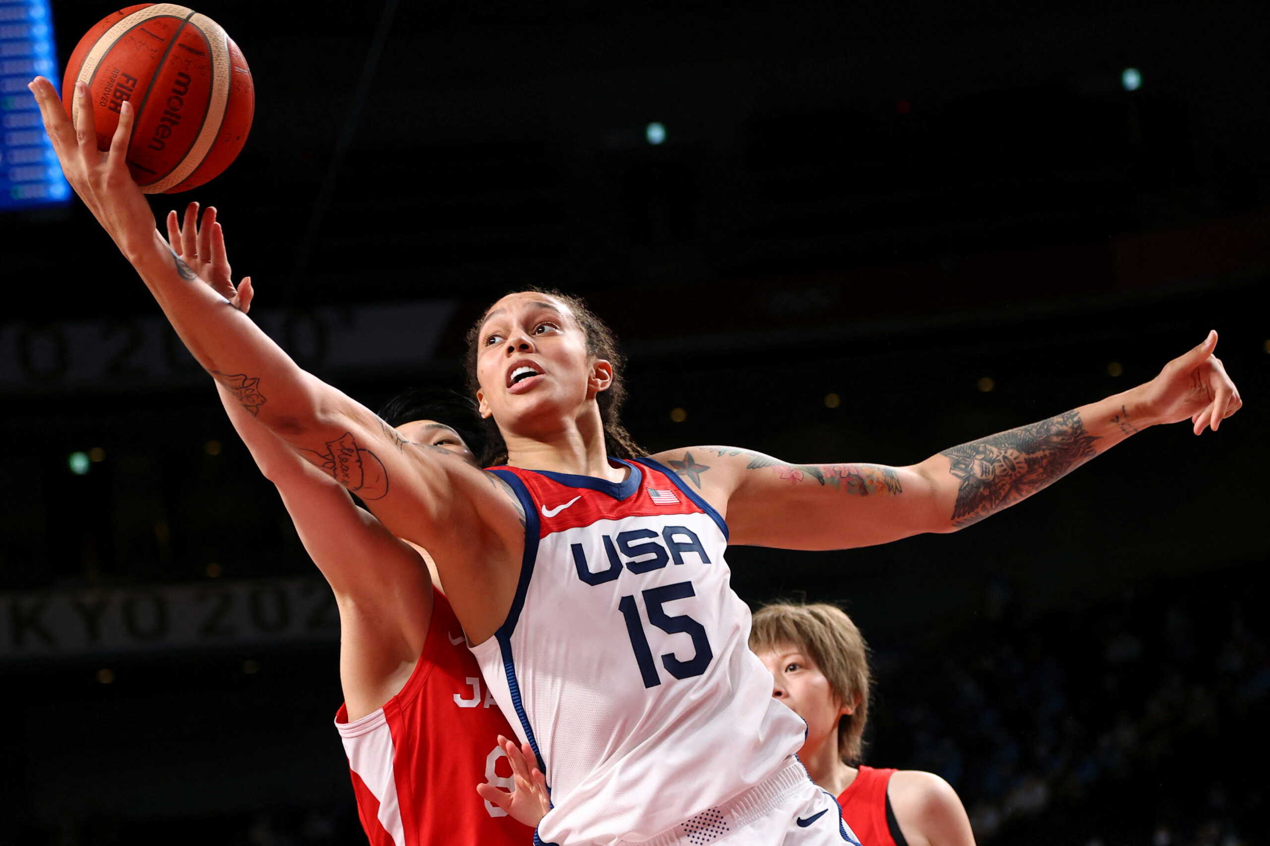 FILE PHOTO: Tokyo 2020 Olympics - Basketball - Women - Gold medal match - United States v Japan - Saitama Super Arena, Saitama, Japan - August 8, 2021. Brittney Griner of the United States in action with Himawari Akaho of Japan REUTERS