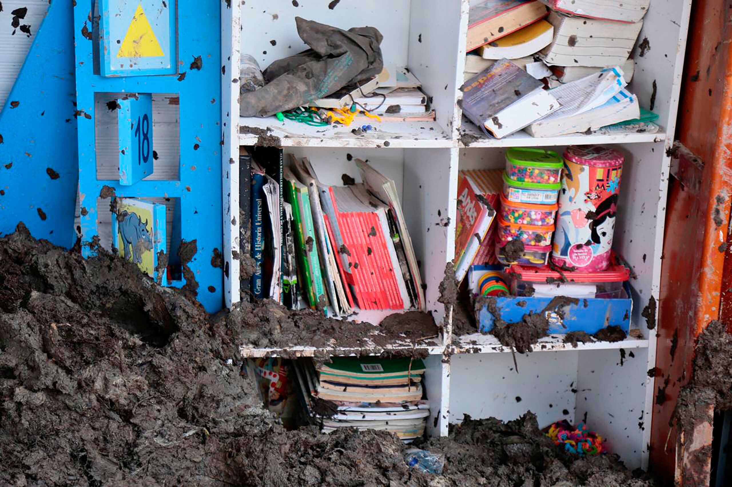 Mud and debris are seen inside a school after a landslide caused by the winter sling where according to local media 19 children were rescued alive and 3 died, in Tapardo, Colombia, July 14, 2022. Administrative Department of Risk Management of Antioquia