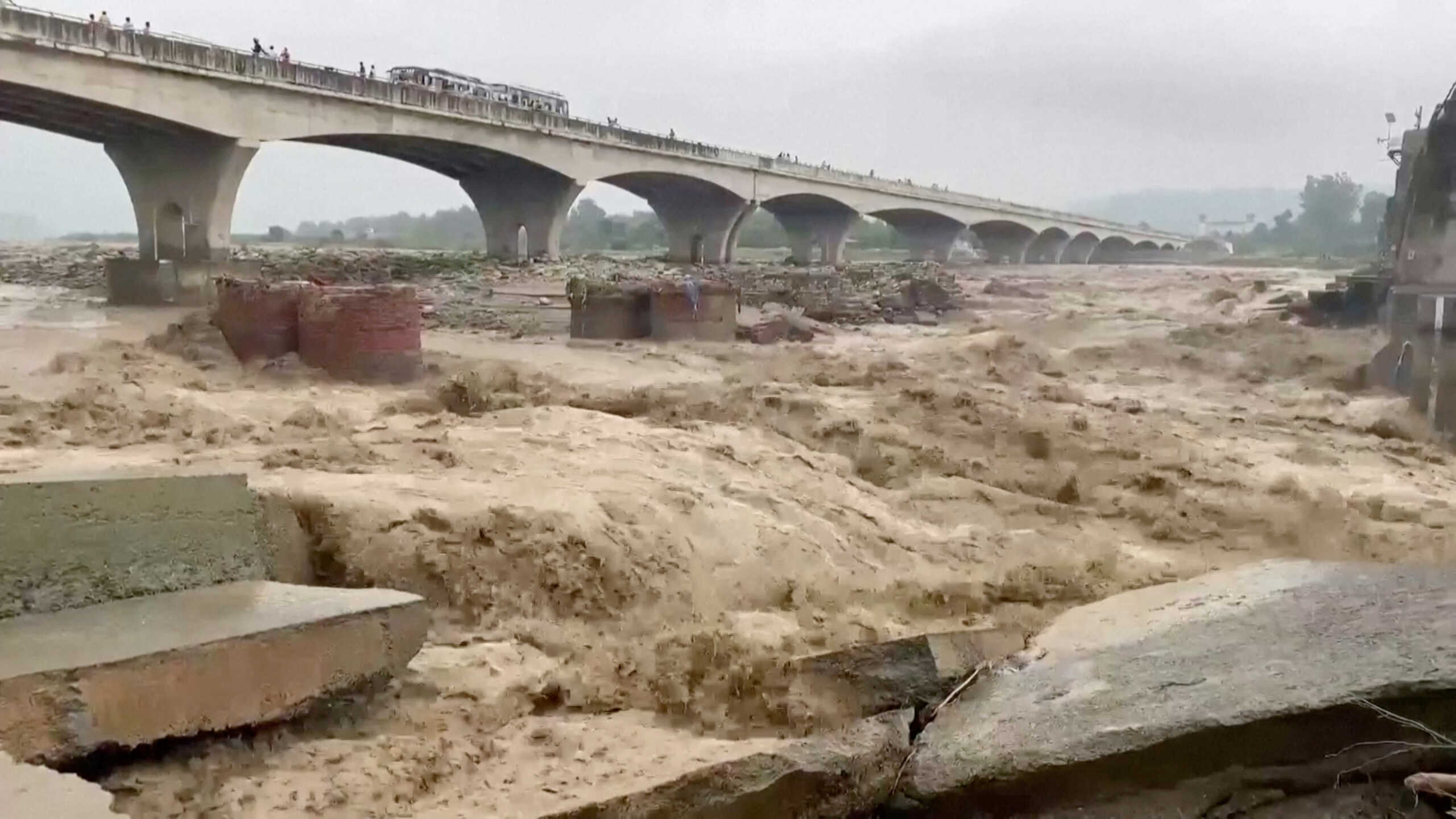 A general view of strong currents in the Chakki river following heavy rains in Kangra, Himachal Pradesh, India August 20, 2022 in this screen grab obtained from a video. ANI via REUTERS THIS IMAGE HAS BEEN SUPPLIED BY A THIRD PARTY. INDIA OUT. NO COMMERCIAL OR EDITORIAL SALES IN INDIA