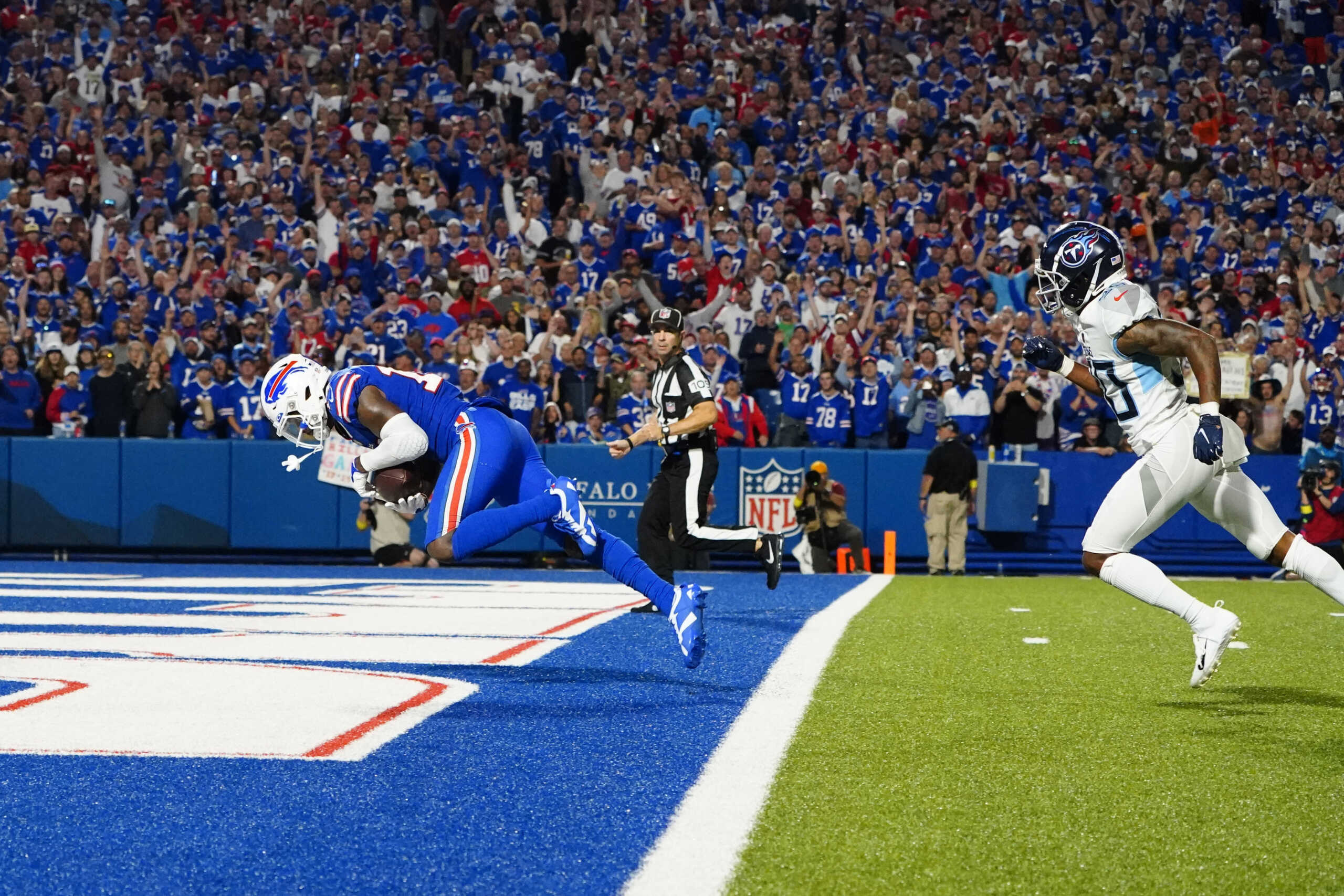 Sep 19, 2022; Orchard Park, New York, USA; Buffalo Bills wide receiver Stefon Diggs (14) catches a pass for a touchdown against the Tennesseee Titans during the second half at Highmark Stadium. Mandatory Credit: Gregory Fisher-USA TODAY Sports