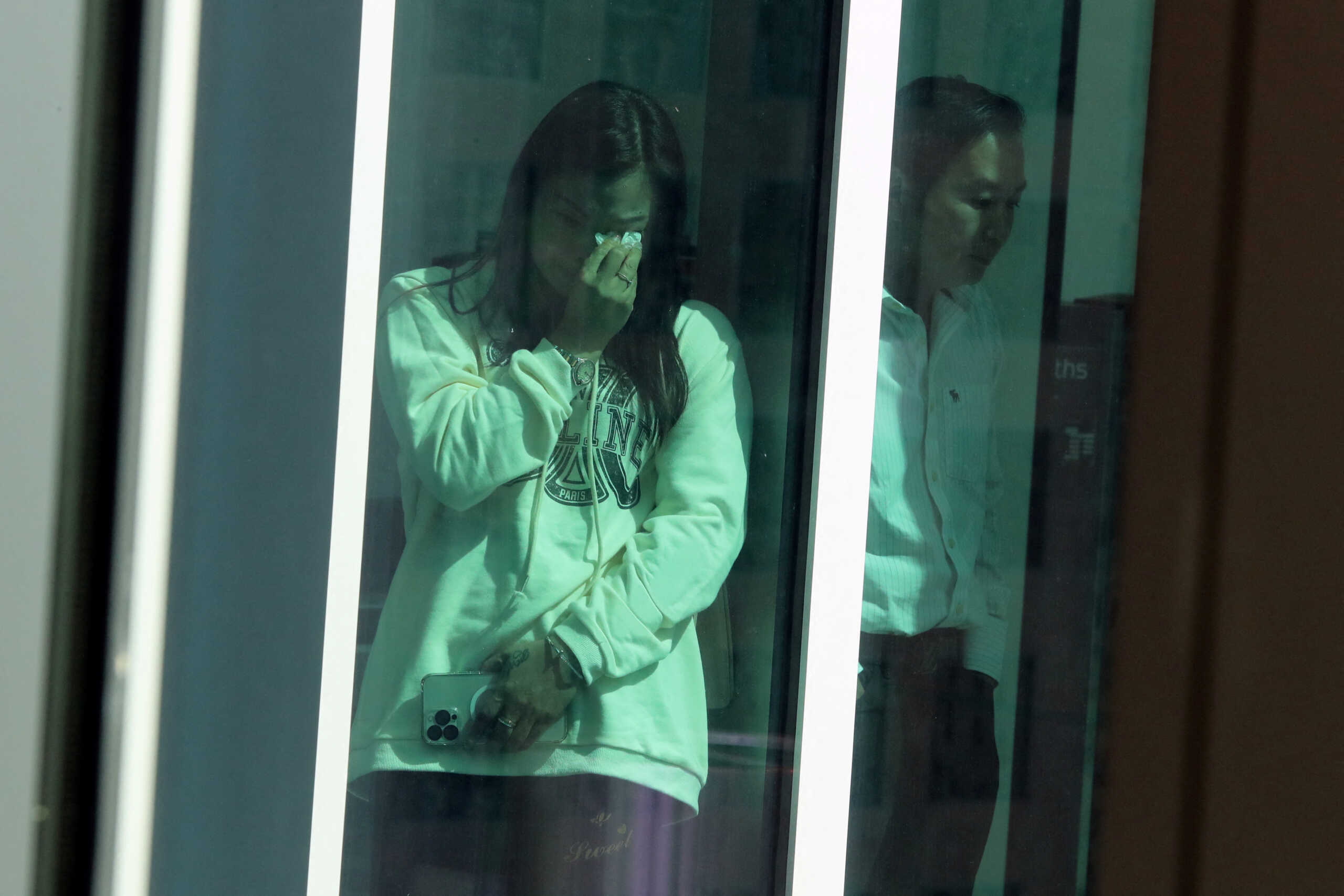 Peter Wang's mother Hui Wang wipes away a tear after the jury rejected a death sentence for Marjory Stoneman Douglas High School shooter Nikolas Cruz at the Broward County Courthouse in Fort Lauderdale, Florida, U.S., October 13, 2022. Peter was killed in the 2018 shootings.   Amy Beth Bennett