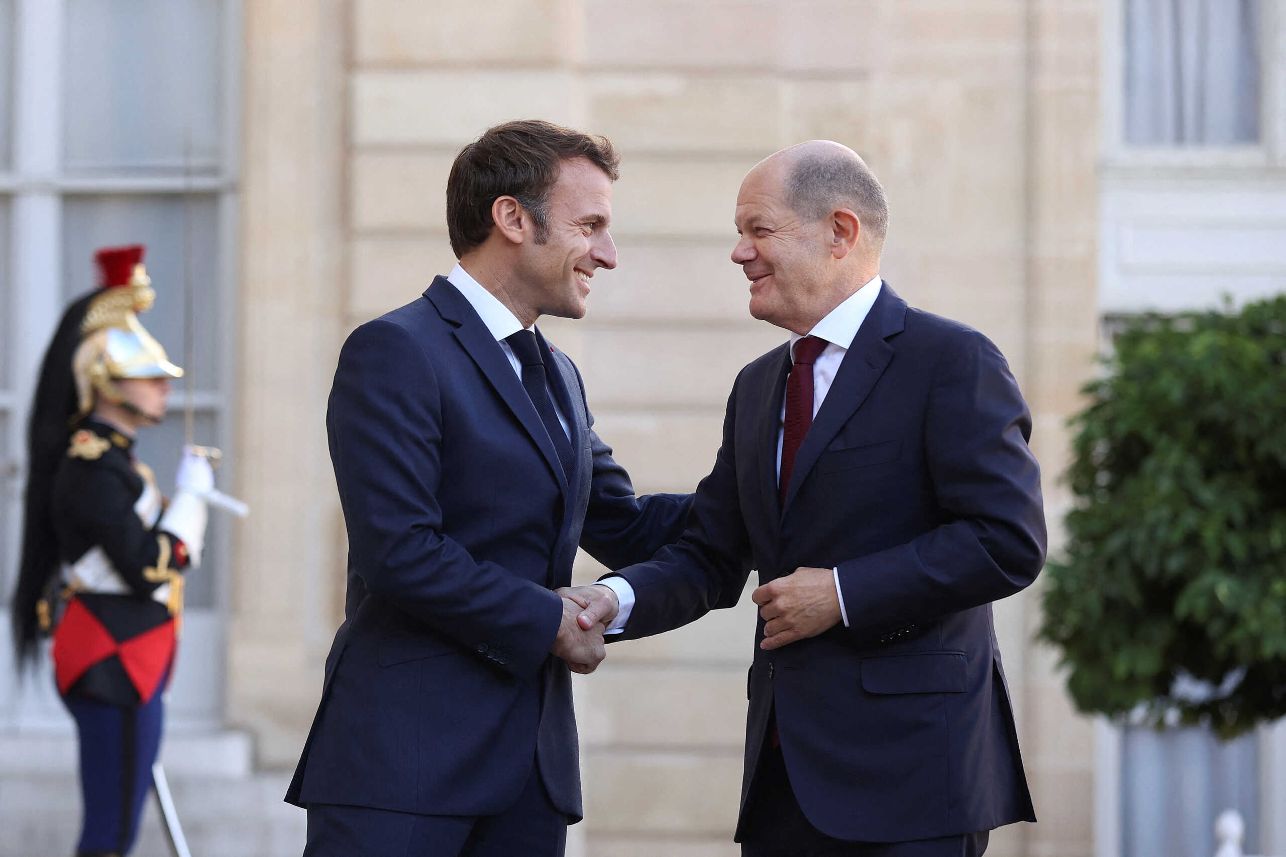 French President Emmanuel Macron welcomes German Chancellor Olaf Scholz before a meeting at the Elysee Palace in Paris, France, October 26, 2022.     Ronny Hartmann