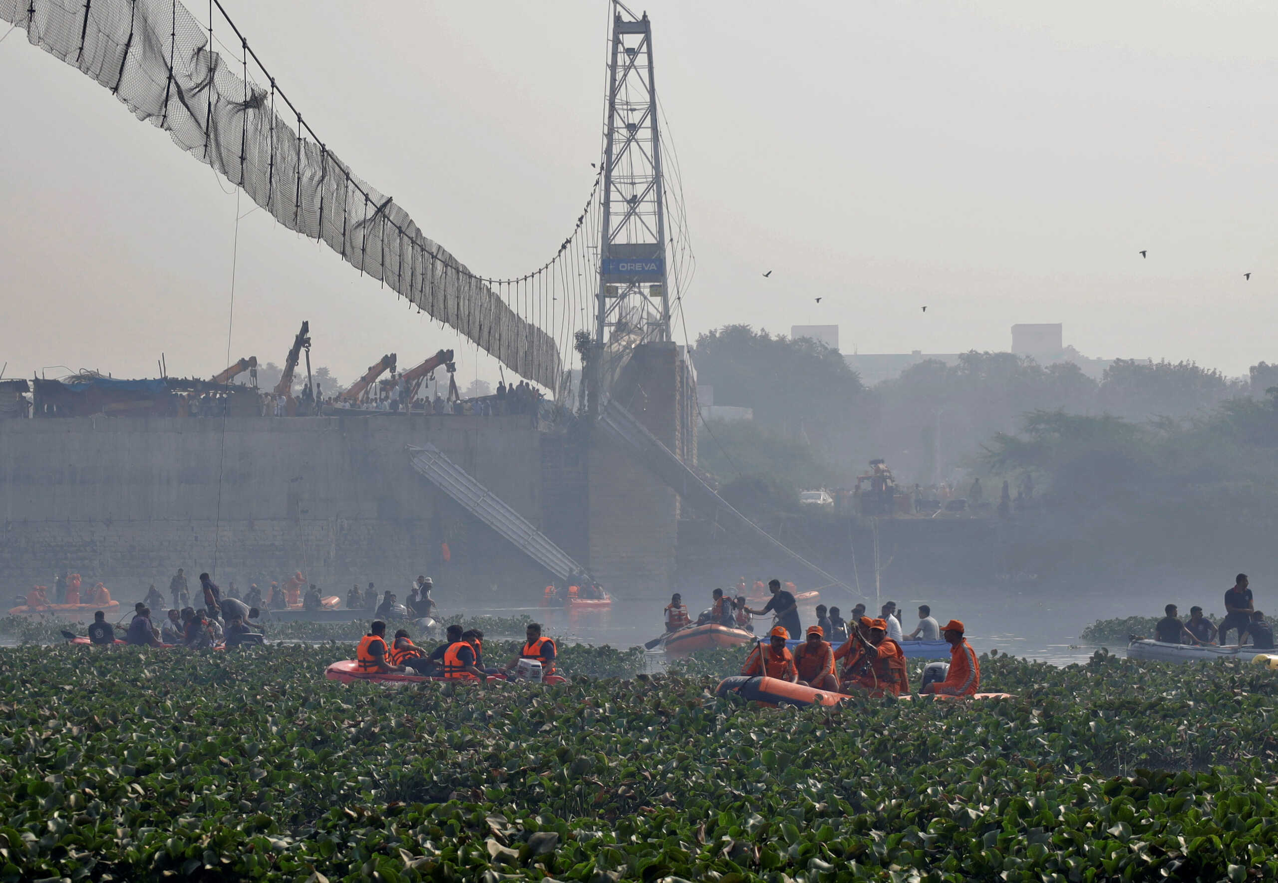 Rescuers search for survivors after a suspension bridge collapsed in Morbi town in the western state of Gujarat, India, October 31, 2022. REUTERS