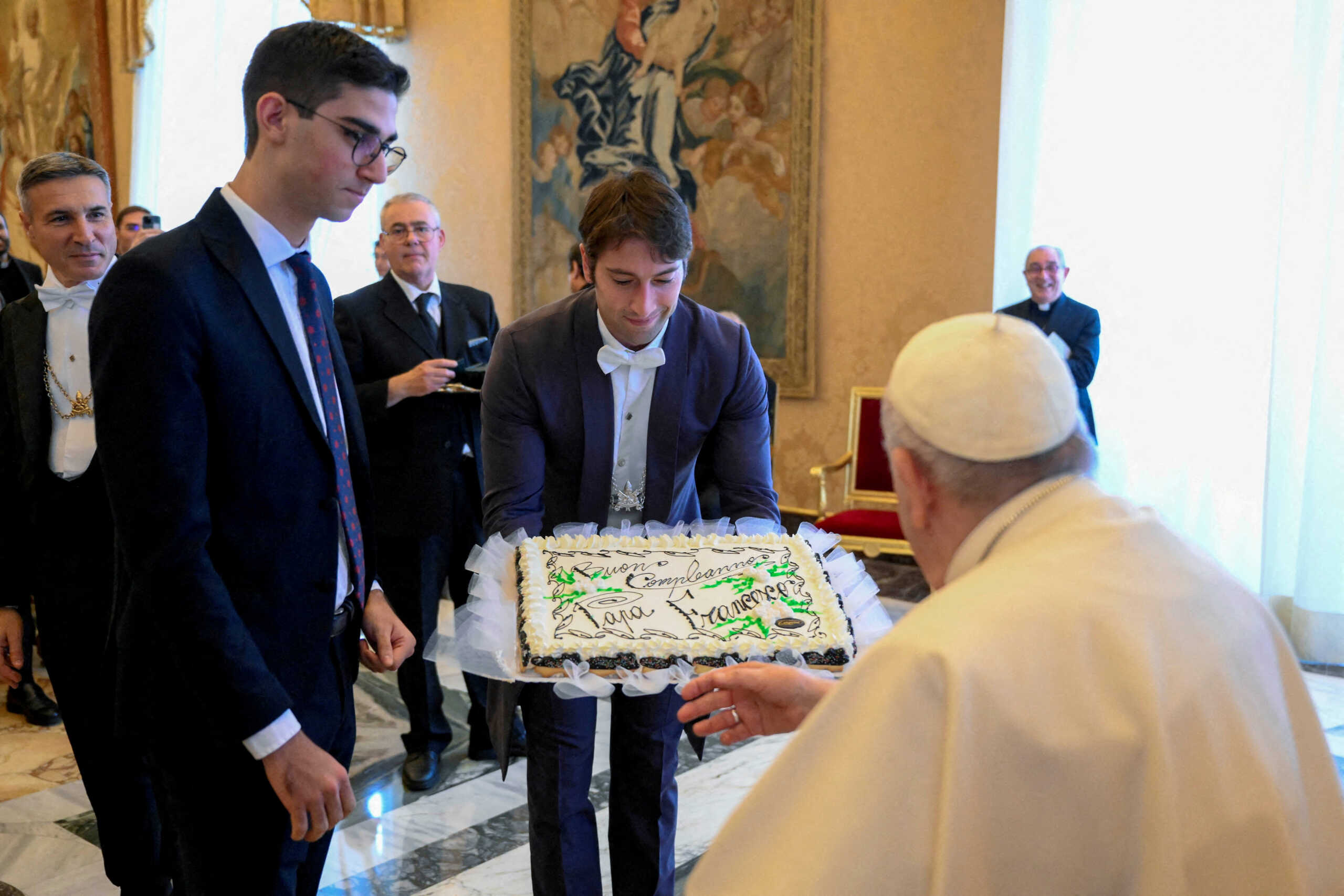 FILE PHOTO: Pope Francis receives a cake during his 86th birthday celebration as he meets with Seminarians of the Diocese of Rome at the Vatican, December 17, 2022.  Vatican Media