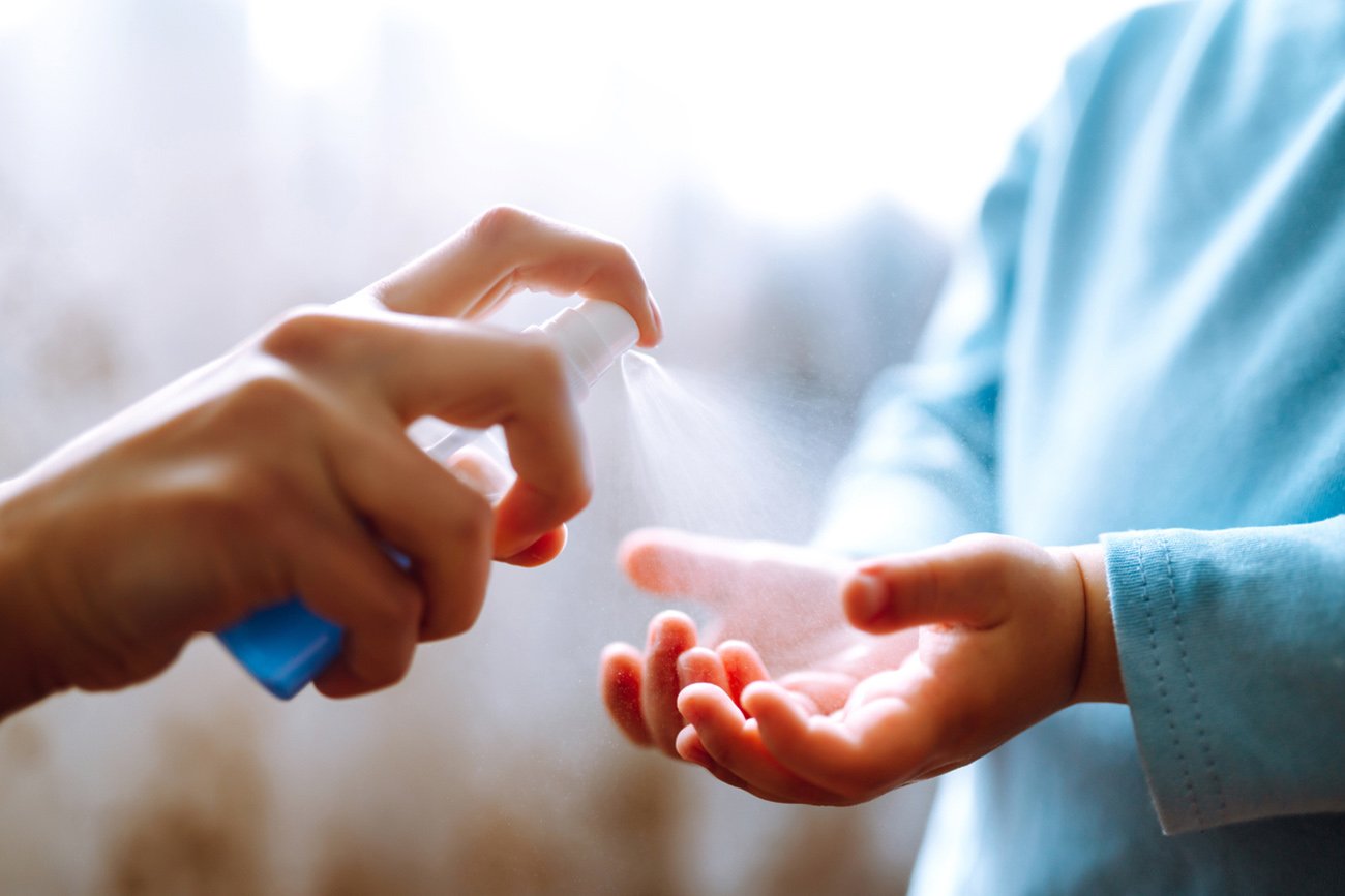 Mother and child using sanitize antiseptic for hand coronavirus protection.Hygiene concept. Prevent spread of germs and bacteria and avoid infections coronavirus.