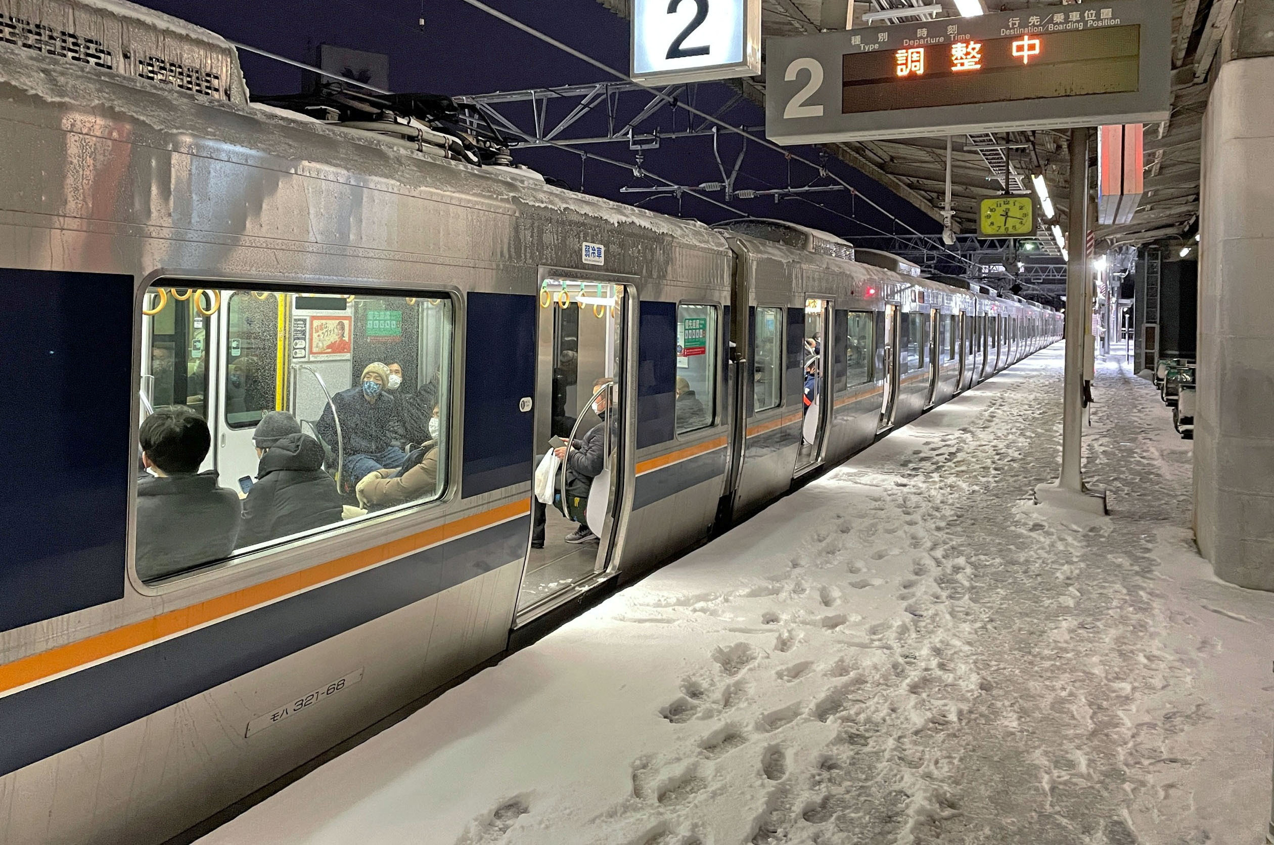 A train is stranded at Nishioji station in Kyoto, Japan in this photo provided by Kyodo on January 25, 2023. Mandatory credit Kyodo