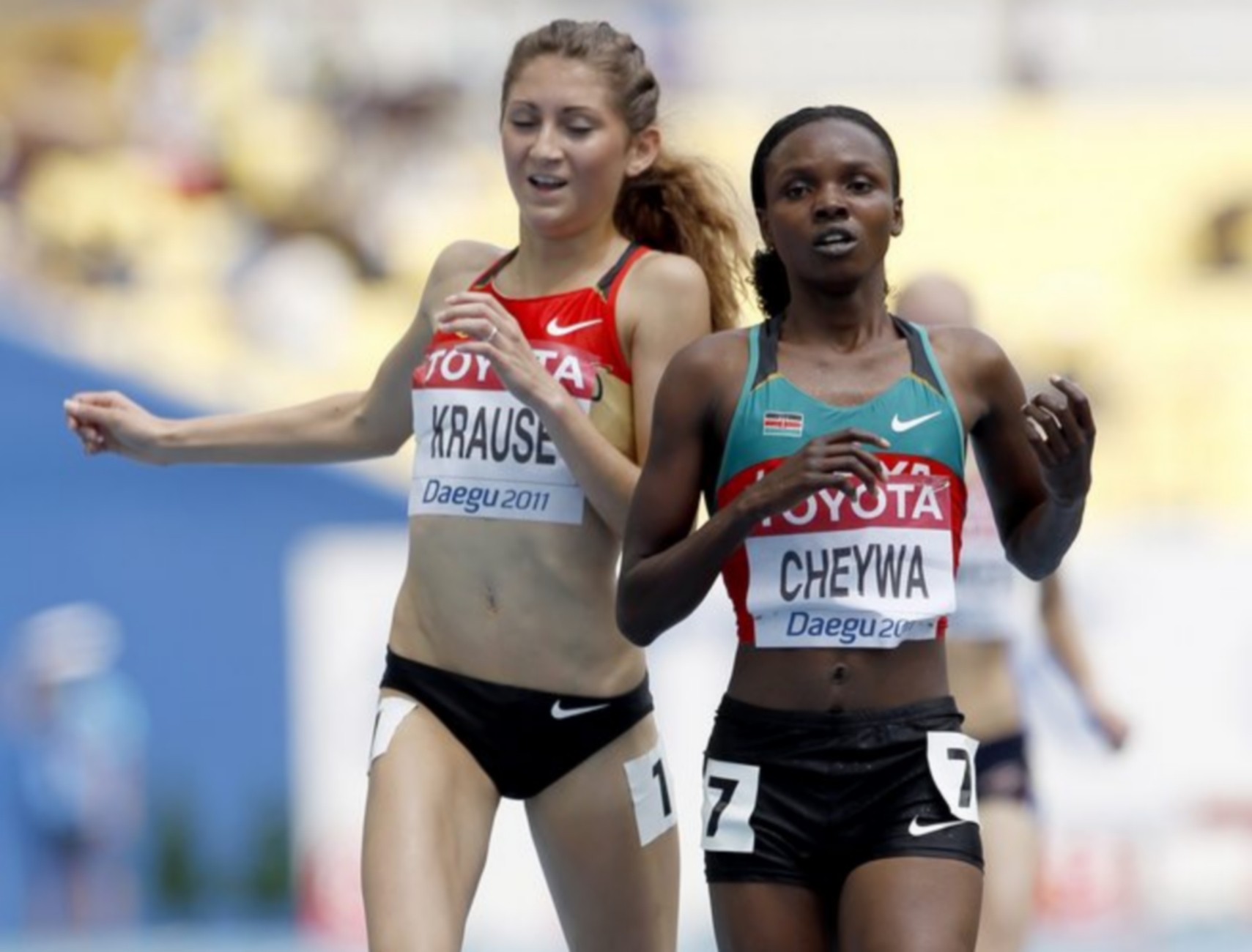 epa02882688 Gesa Krause from Germany (L) and Milcah Cheywa from Kenya (R) cross the finnish line in the womens 3000m Steeplechase round 1 during the 13th IAAF World Championships in Daegu, Republic of Korea, 27 August 2011  EPA