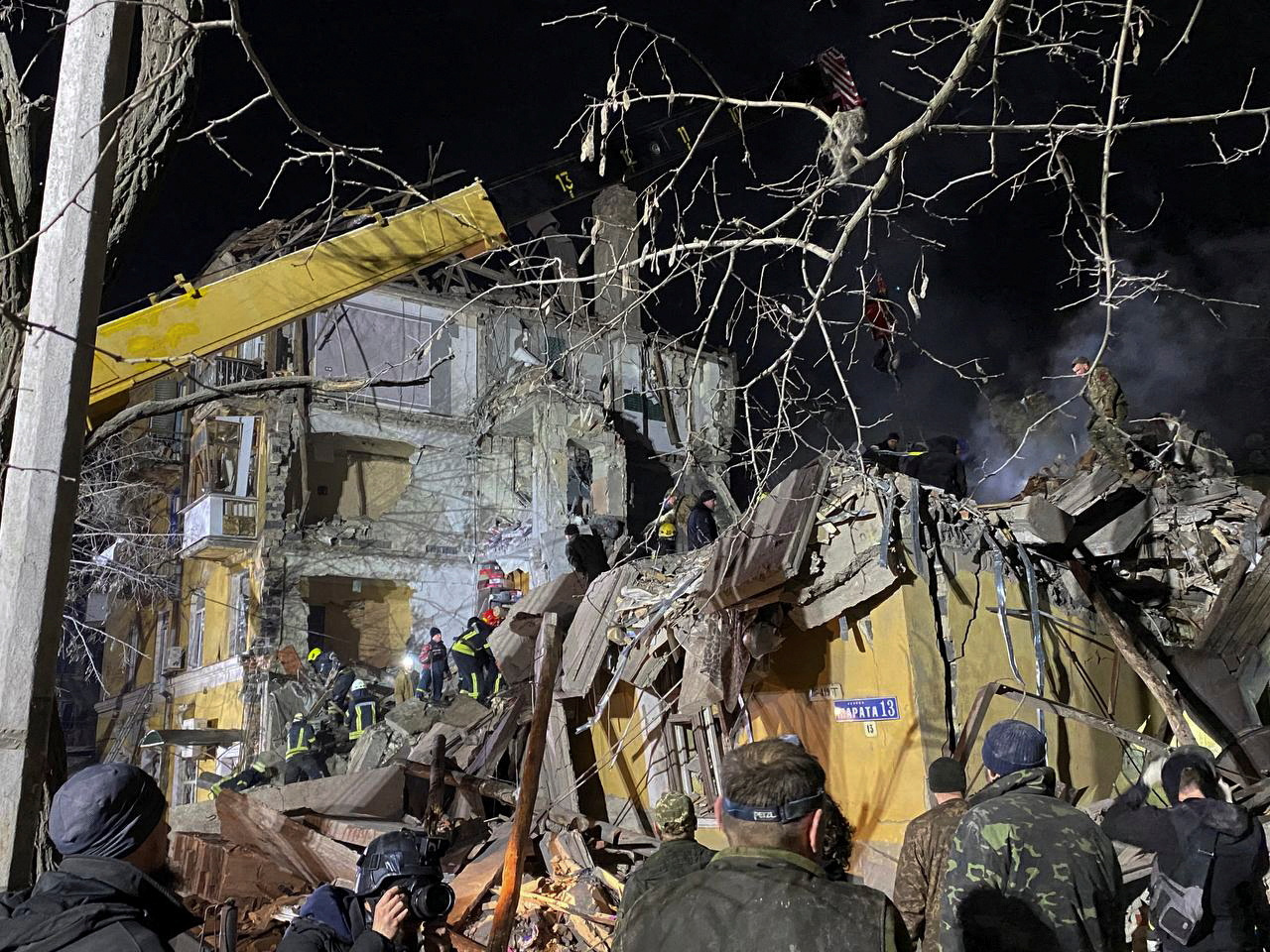 People work at a site of a residential building destroyed by a Russian missile strike, amid Russia’s attack on Ukraine, in Kramatorsk, Ukraine February 1, 2023. Radio Free Europe