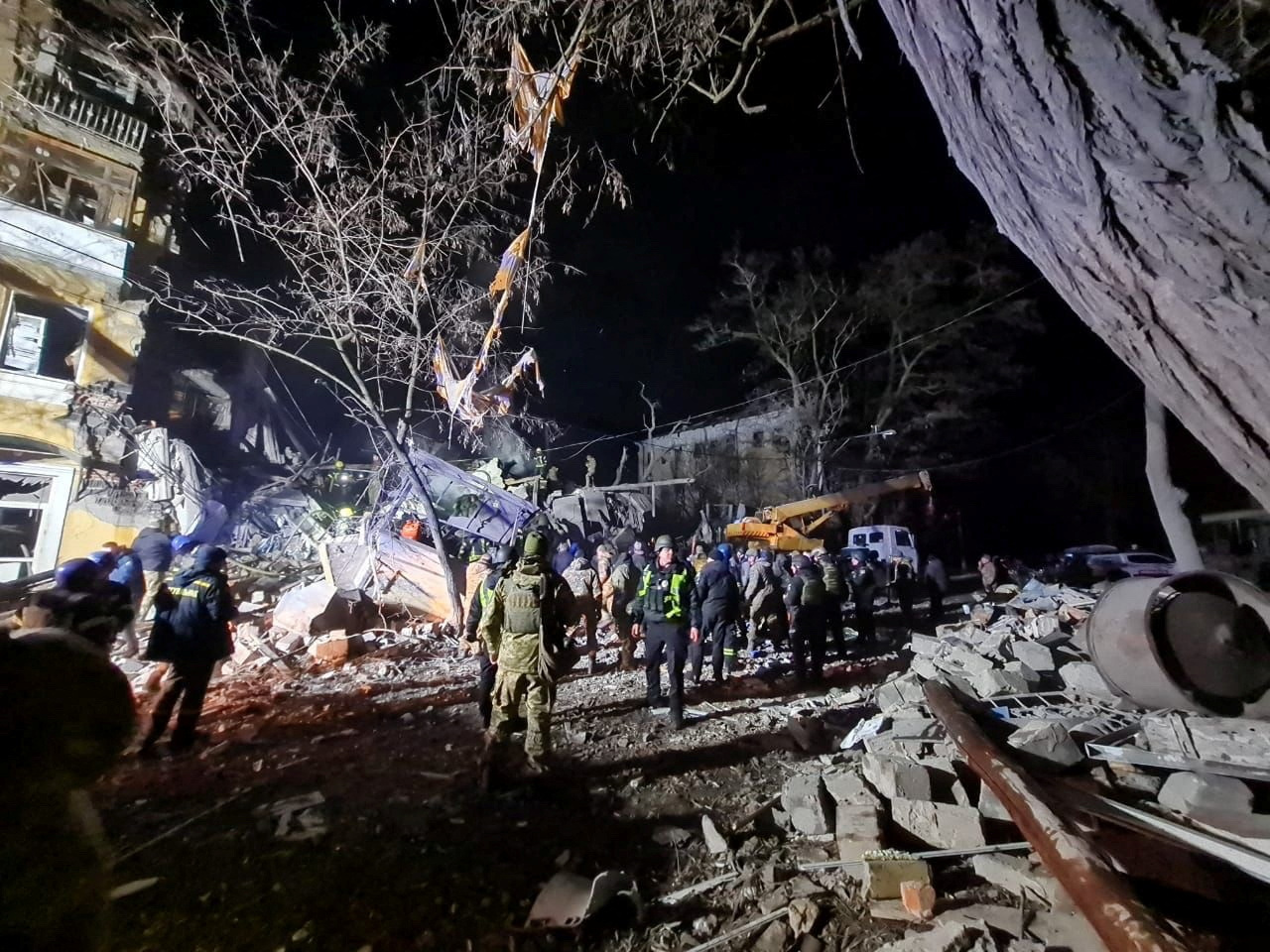 People work at a site of a residential building destroyed by a Russian missile strike, amid Russia’s attack on Ukraine, in Kramatorsk, Ukraine February 1, 2023. Ukrainian Presidential Press Service