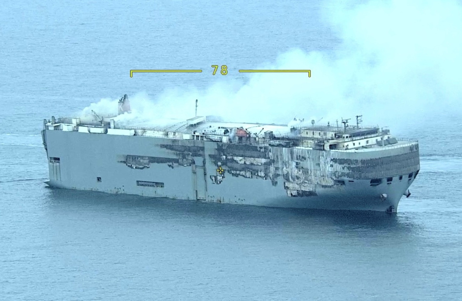 Smoke rises from burning cargo ship Fremantle Highway at sea, Netherlands, July 28, 2023. Dutch Coastguard