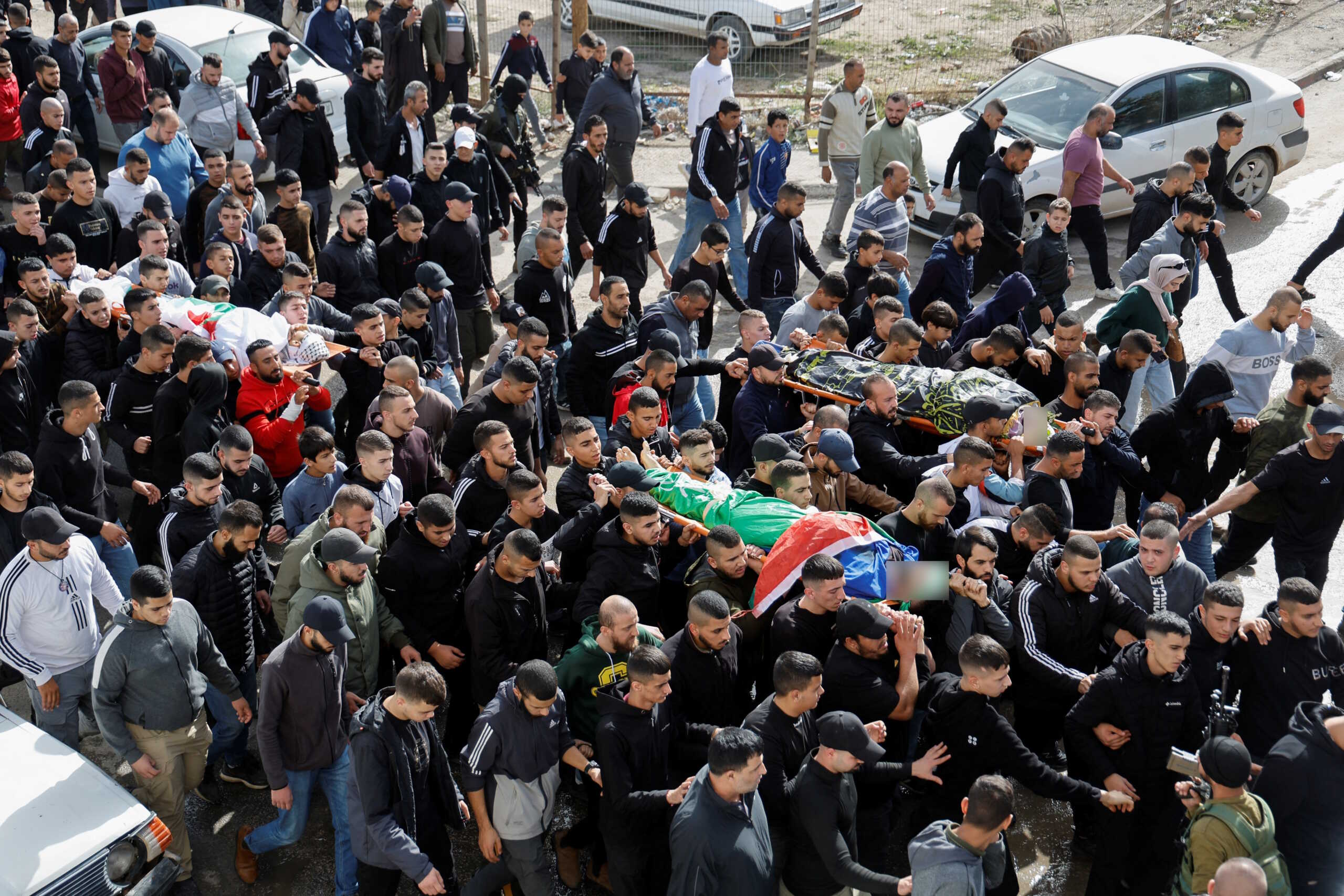 SENSITIVE MATERIAL. THIS IMAGE MAY OFFEND OR DISTURB Mourners carry the bodies of Palestinians who were killed during an Israeli raid in Jenin in the Israeli-occupied West Bank November 26, 2023. REUTERS