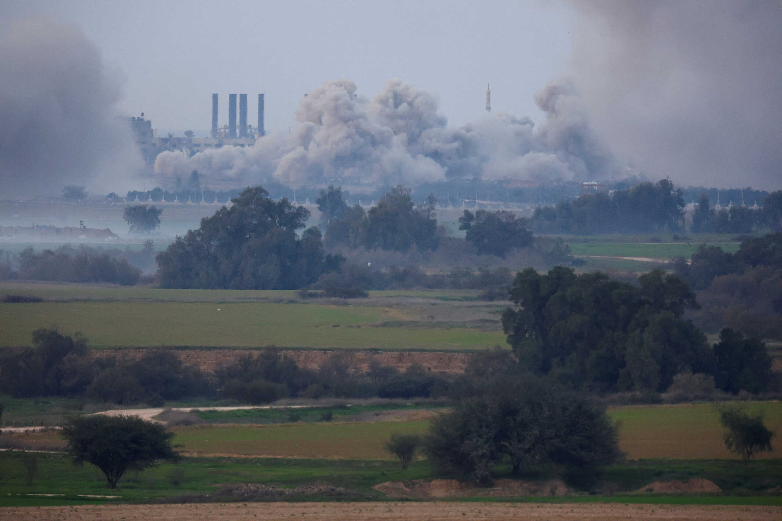 Smoke rises over Gaza, amid the ongoing conflict between Israel and the Palestinian Islamist group Hamas, as seen from southern Israel, December 30, 2023. REUTERS