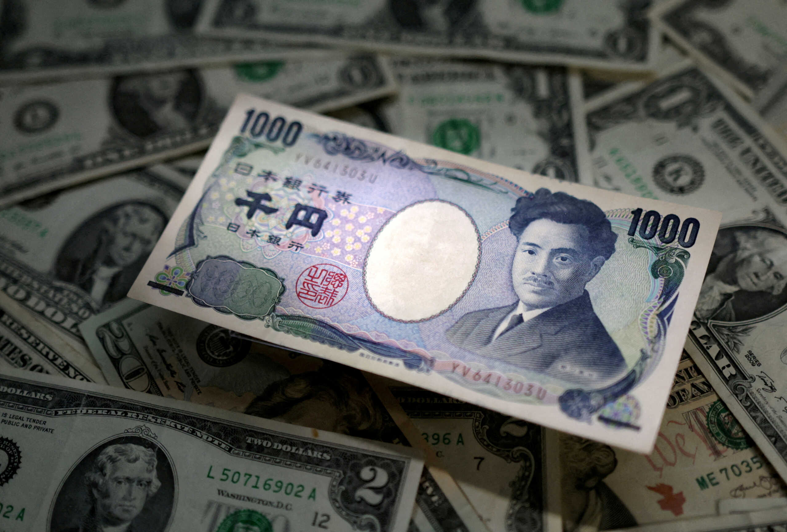 FILE PHOTO: FILE PHOTO: Japanese Yen and U.S. dollar banknotes are seen in this illustration taken March 10, 2023. REUTERS