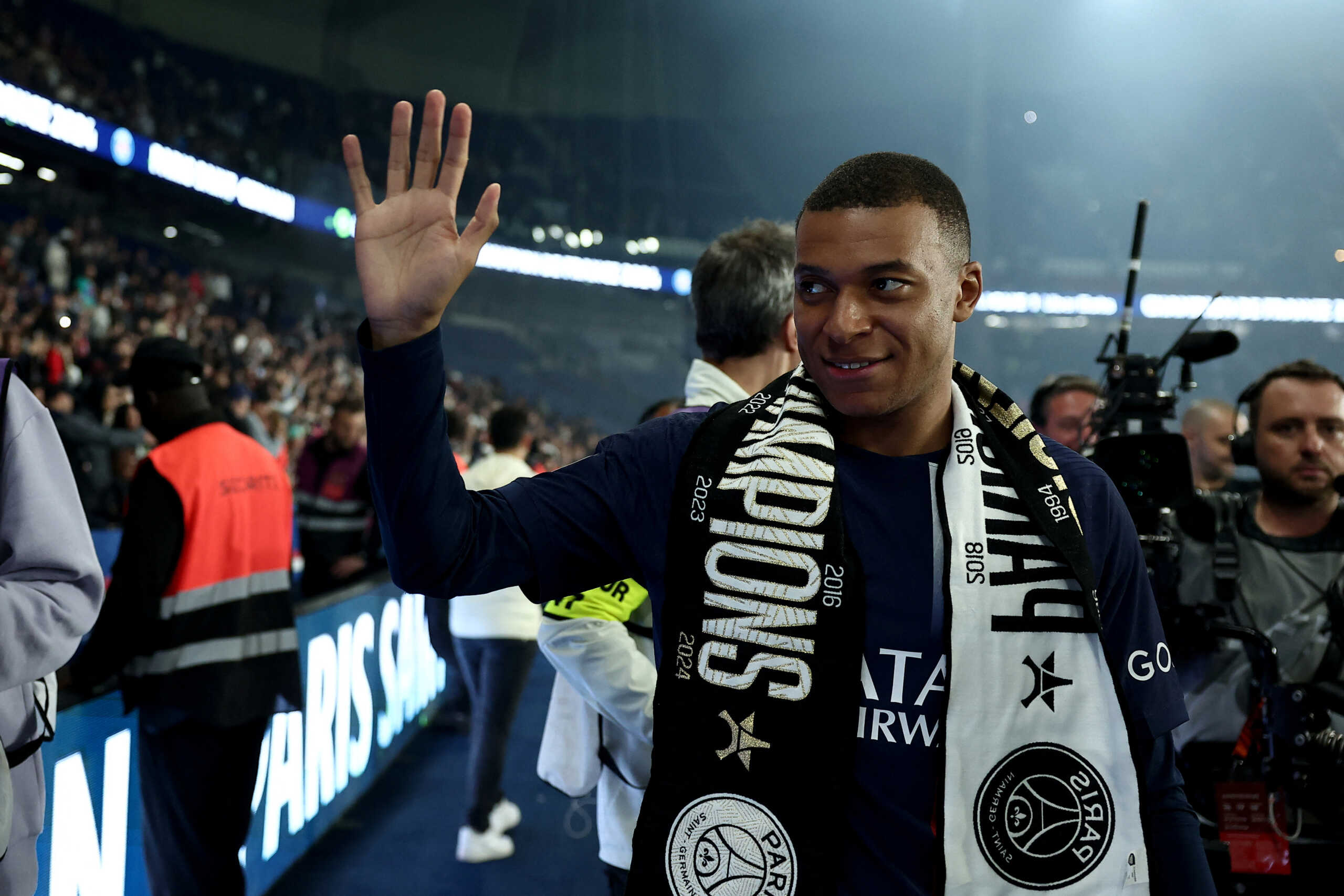 Paris Saint-Germain's French forward Kylian Mbappe greets the fans during a ceremony following the French L1 football match between Paris Saint-Germain (PSG) and Toulouse (TFC) on May 12, 2024 at the Parc des Princes stadium in Paris. FRANCK FIFE