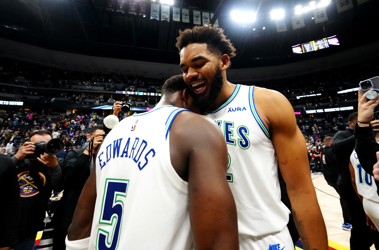 May 19, 2024; Denver, Colorado, USA; Minnesota Timberwolves center Karl-Anthony Towns (32) and Anthony Edwards (5) celebrate defeating the Denver Nuggets in game seven of the second round for the 2024 NBA playoffs at Ball Arena. Mandatory Credit: Ron Chenoy-USA TODAY Sports