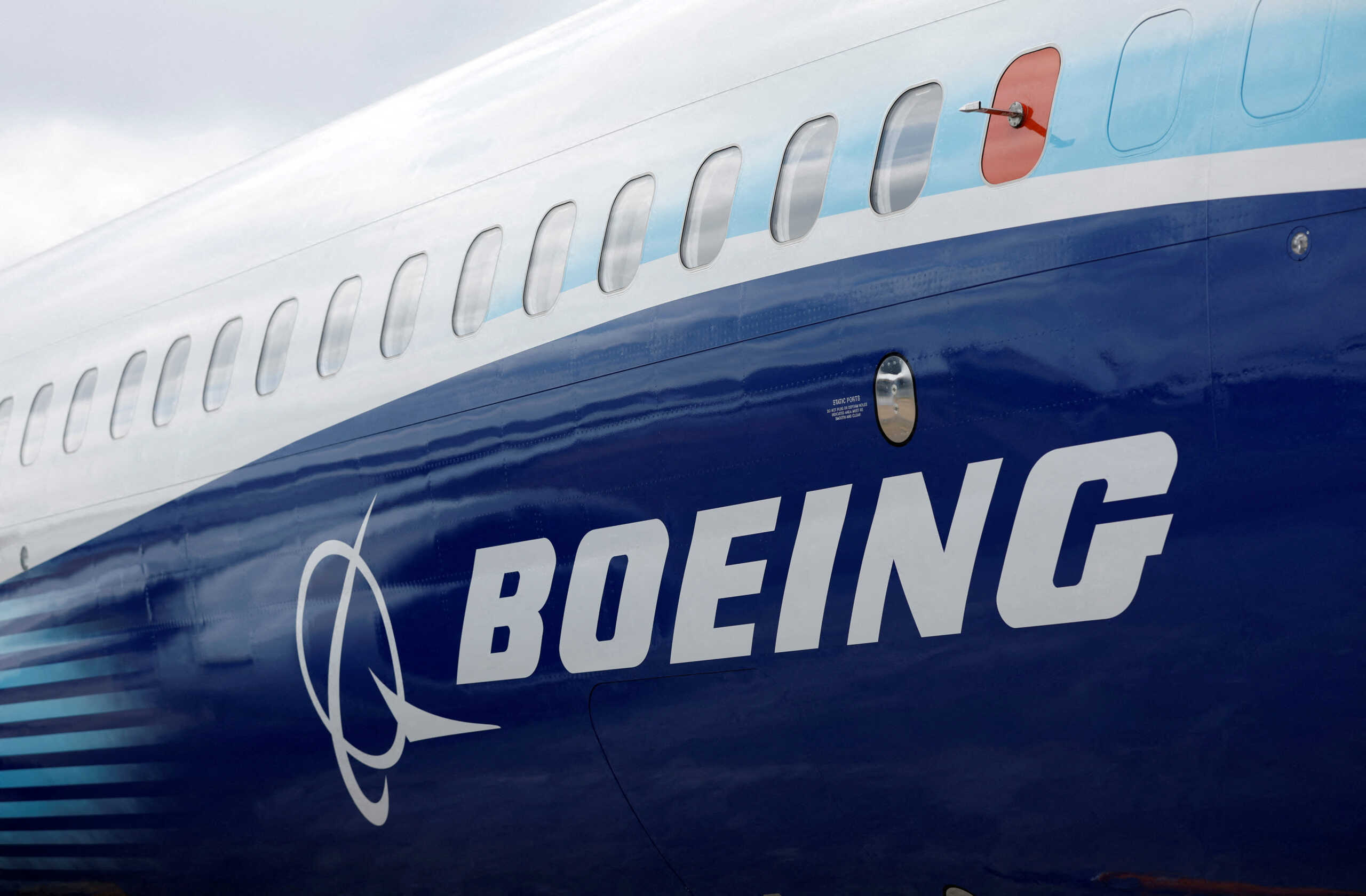 FILE PHOTO: The Boeing logo is seen on the side of a Boeing 737 MAX at the Farnborough International Airshow, in Farnborough, Britain, July 20, 2022.  REUTERS