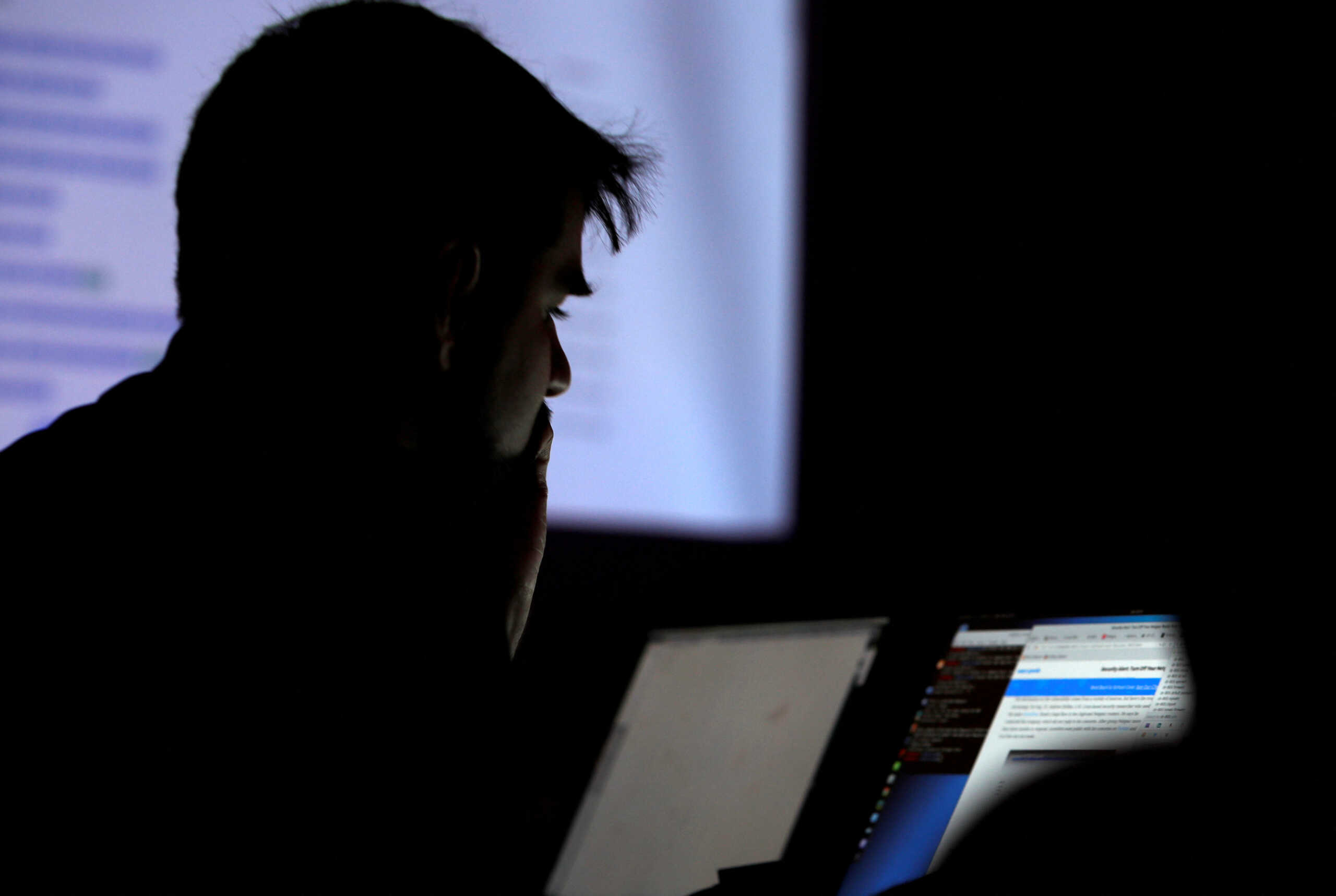 FILE PHOTO: A man takes part in a hacking contest during the Def Con hacker convention in Las Vegas, Nevada, U.S. on July 29, 2017. REUTERS