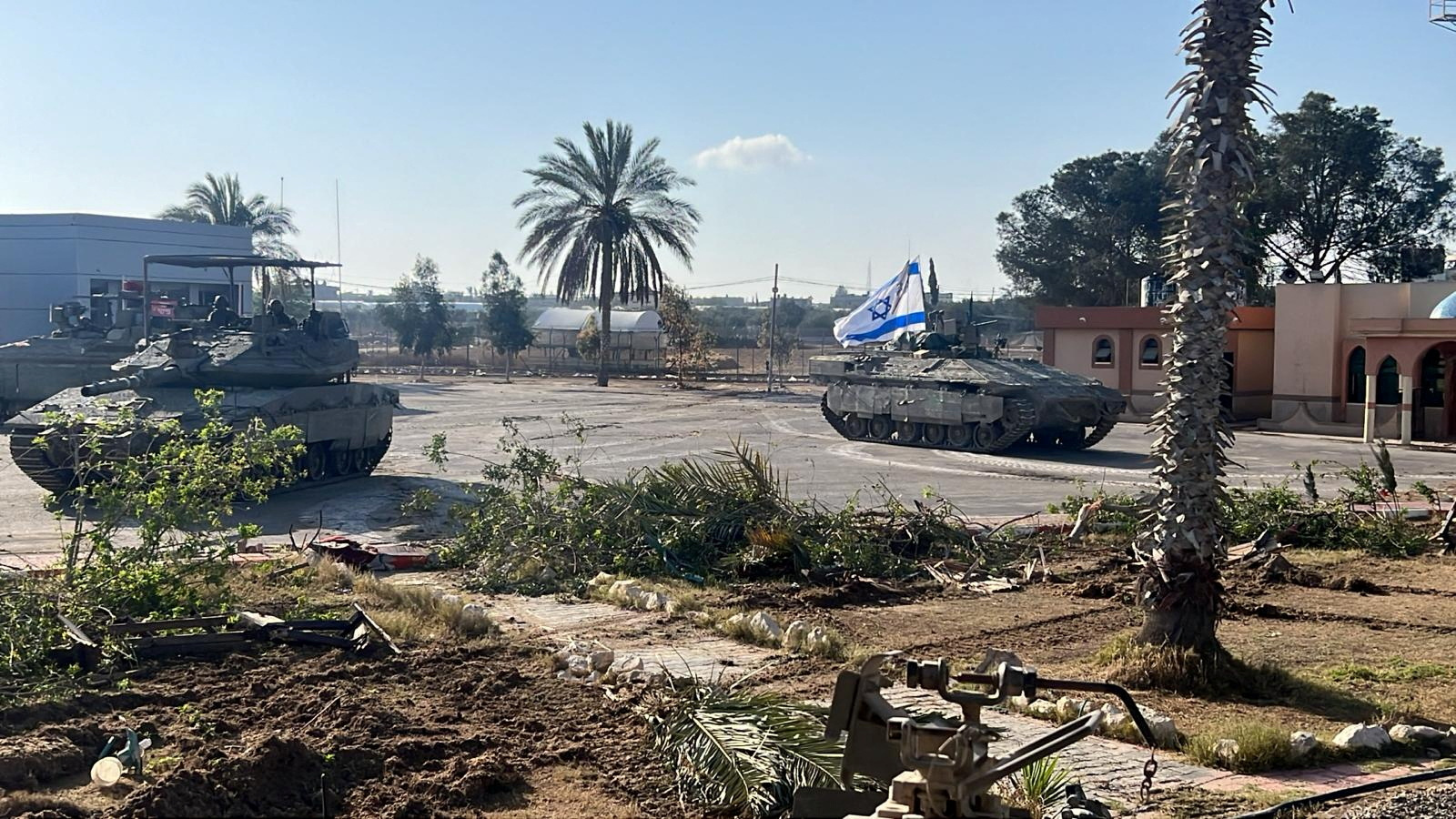 Israeli military vehicles operate in the Gazan side of the Rafah Crossing, amid the ongoing conflict between Israel and Palestinian Islamist group Hamas, in the southern Gaza Strip, in this handout image released on May 7, 2024. Israel Defense Forces