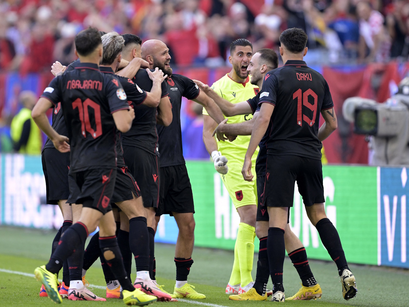 Soccer Football - Euro 2024 - Group B - Croatia v Albania - Hamburg Volksparkstadion, Hamburg, Germany - June 19, 2024 Albania's Klaus Gjasula celebrates scoring their second goal with teammates REUTERS