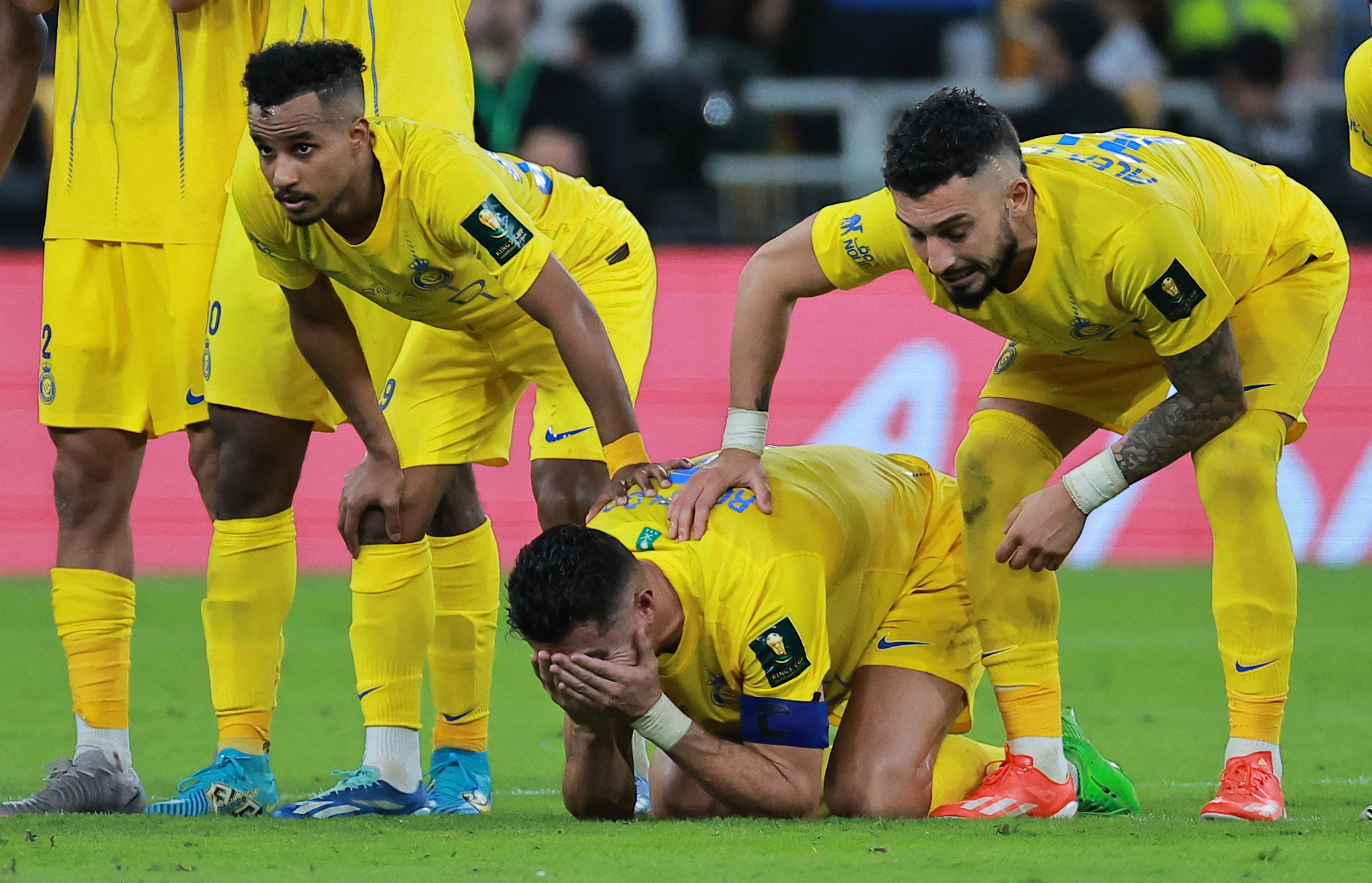 Soccer Football - Saudi King Cup - Final - Al Hilal v Al Nassr - King Abdullah Sport City, Jeddah, Saudi Arabia - June 1, 2024  Al Nassr's Cristiano Ronaldo, Alex Telles and Abdulrahman Ghareeb look dejected after losing the penalty shootout and the Saudi King Cup final REUTERS