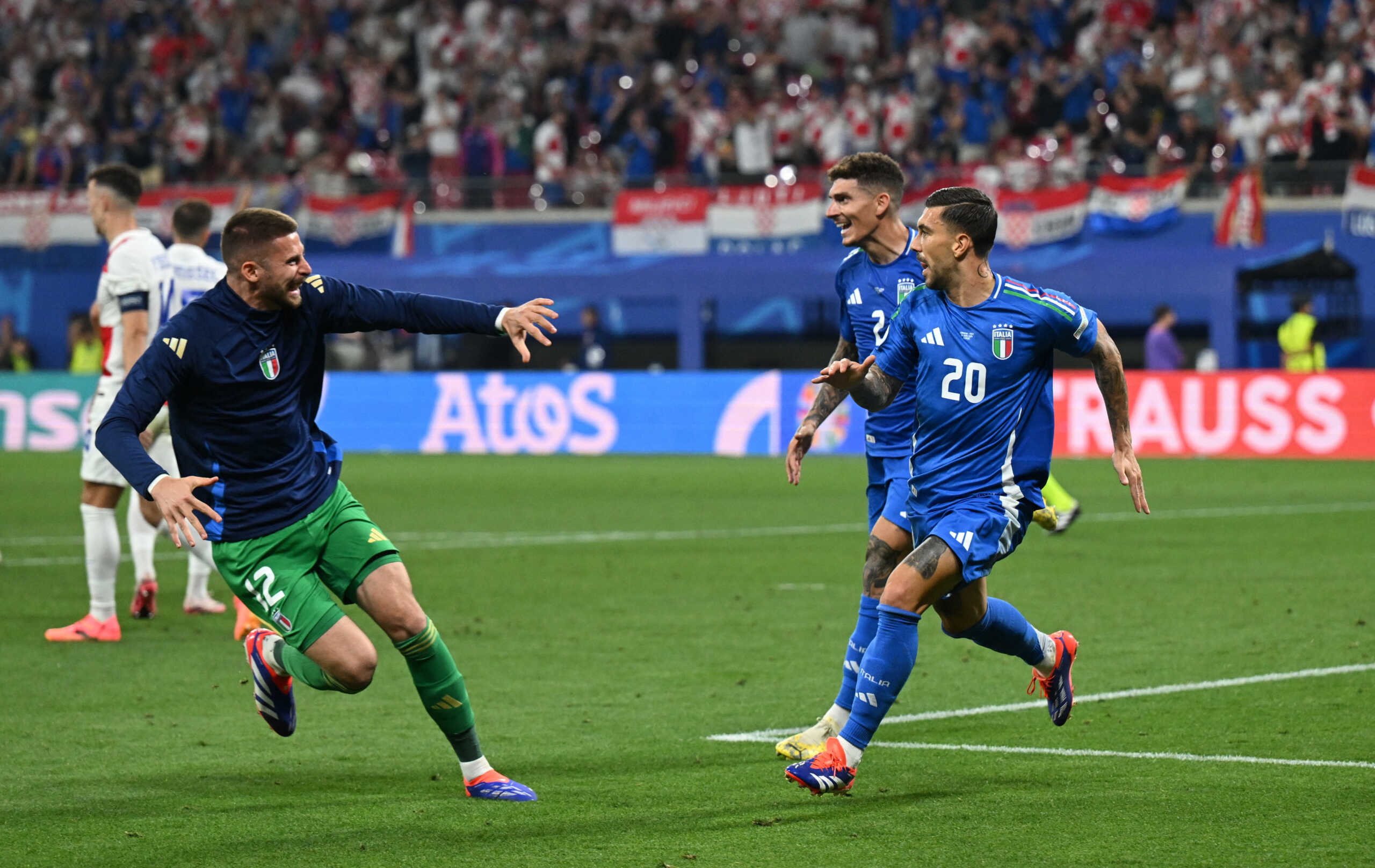 Soccer Football - Euro 2024 - Group B - Croatia v Italy - Leipzig Stadium, Leipzig, Germany - June 24, 2024  Italy's Mattia Zaccagni celebrates scoring their first goal with Guglielmo Vicario and Giovanni Di Lorenzo REUTERS