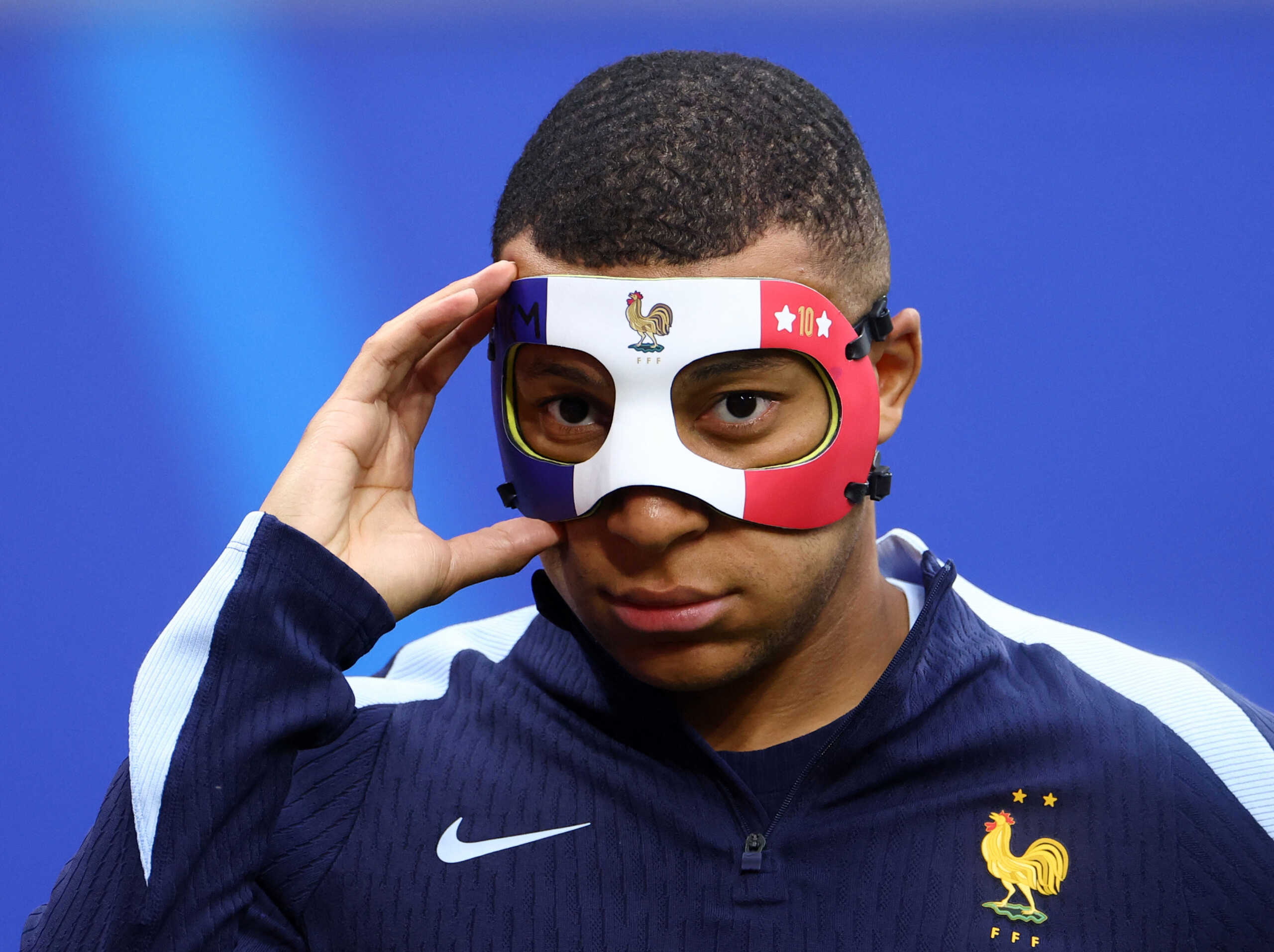 Soccer Football - Euro 2024 - France Training - Leipzig Stadium, Leipzig, Germany - June 20, 2024 France's Kylian Mbappe wears a protective mask during training REUTERS