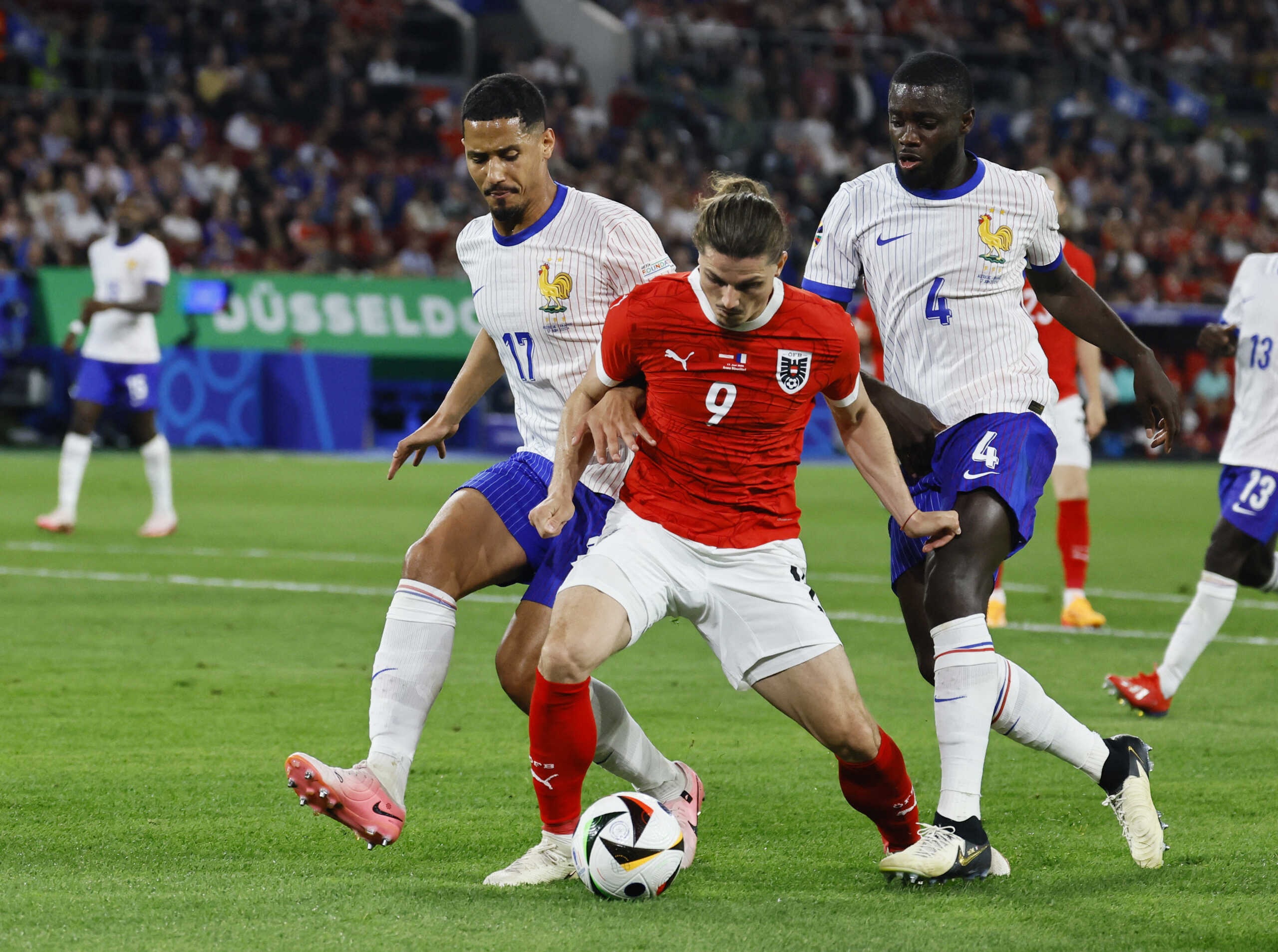 Soccer Football - Euro 2024 - Group D - Austria v France - Dusseldorf Arena, Dusseldorf, Germany - June 17, 2024 France's William Saliba and Dayot Upamecano in action with Austria's Marcel Sabitzer REUTERS