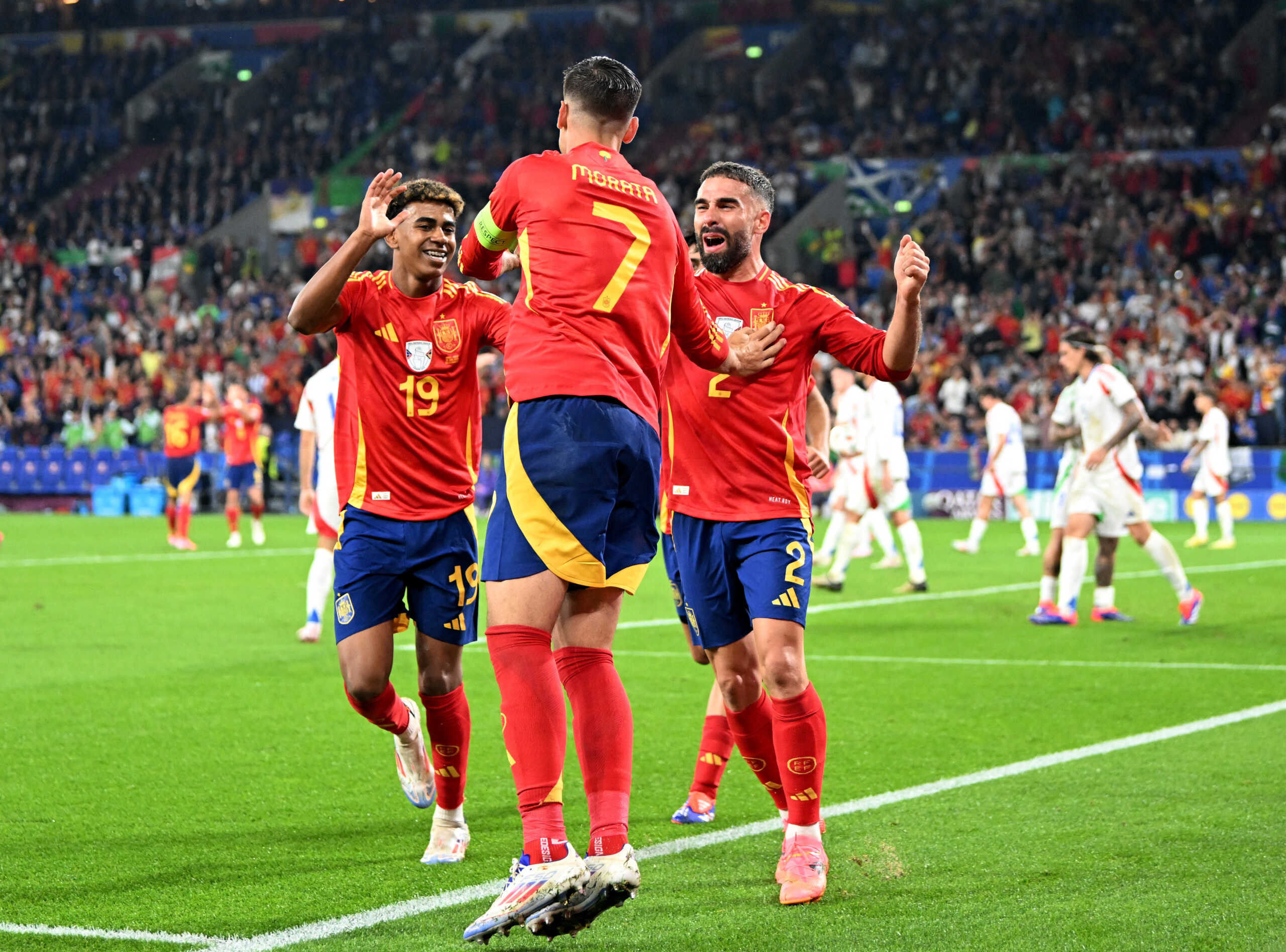 Soccer Football - Euro 2024 - Group B - Spain v Italy - Arena AufSchalke, Gelsenkirchen, Germany - June 20, 2024 Spain's Alvaro Morata, Lamine Yamal and Dani Carvajal celebrate their first goal, an own goal scored by Italy's Riccardo Calafiori REUTERS