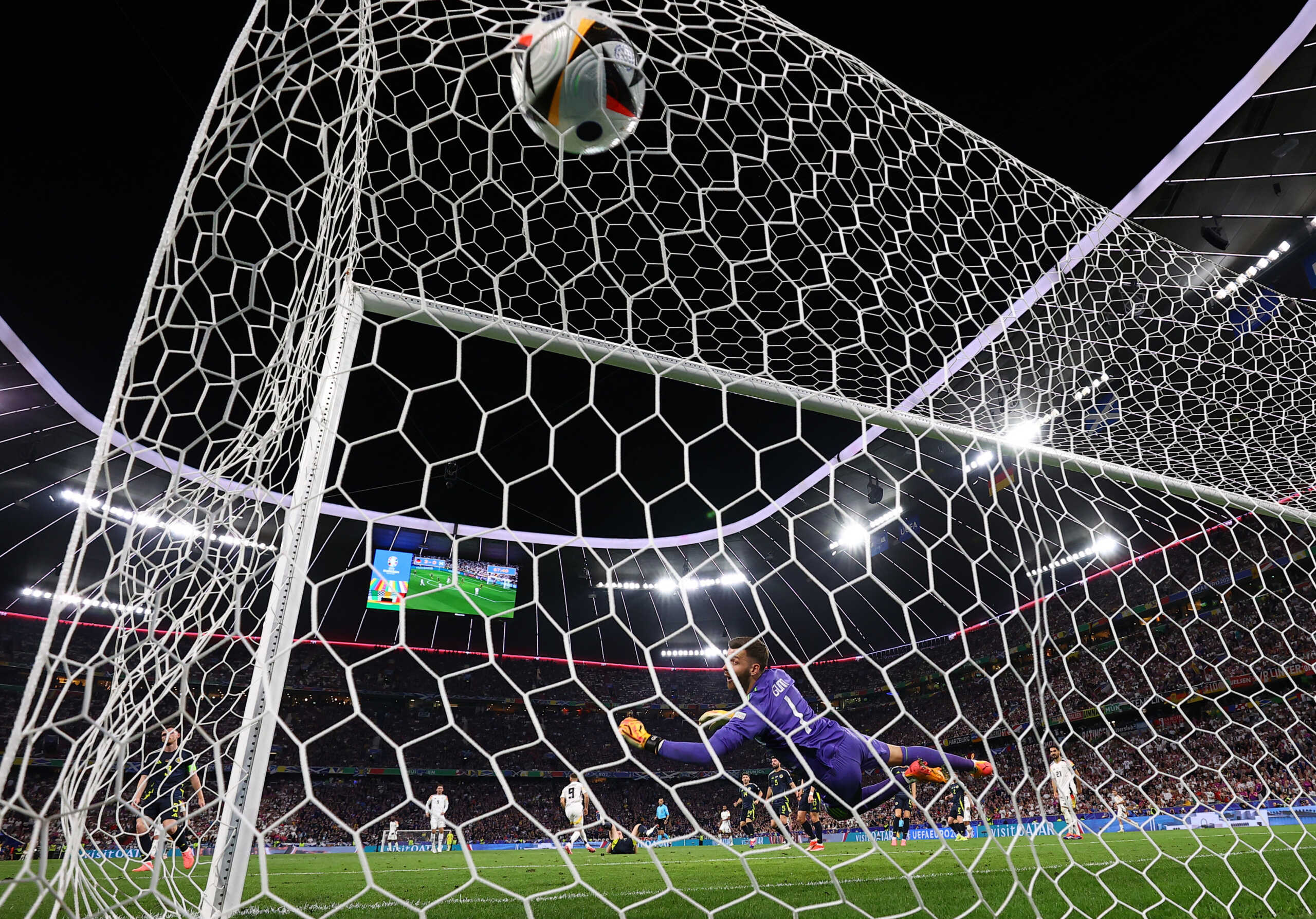 Soccer Football - Euro 2024 - Group A - Germany v Scotland - Munich Football Arena, Munich, Germany - June 14, 2024   Germany's Niclas Fullkrug scores their fourth goal past Scotland's Angus Gunn REUTERS